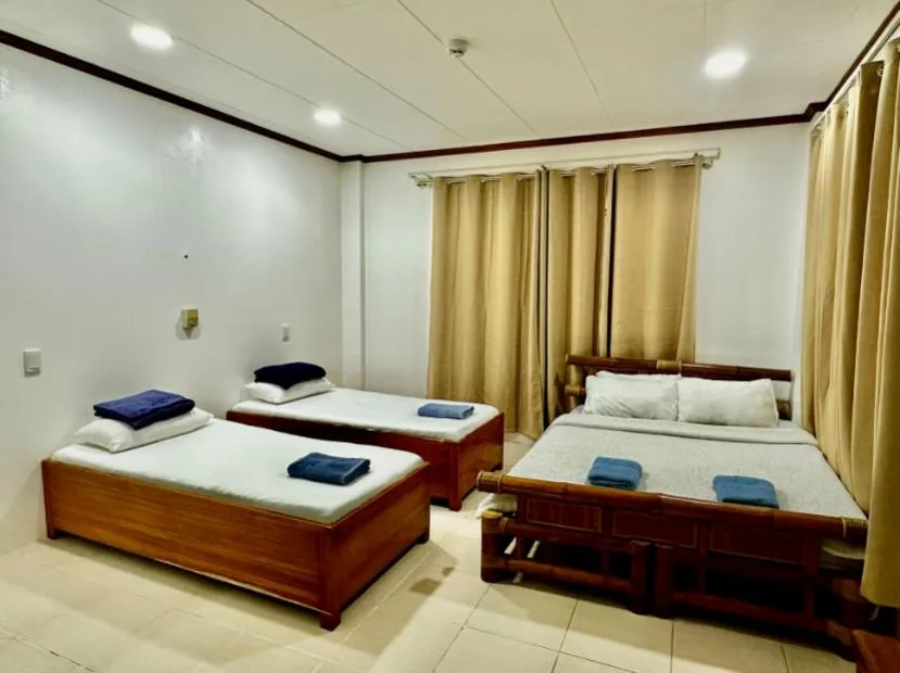 Photo of the whole room, Bed in Bluewaves Hostel & Villa Panagsama by Hiverooms