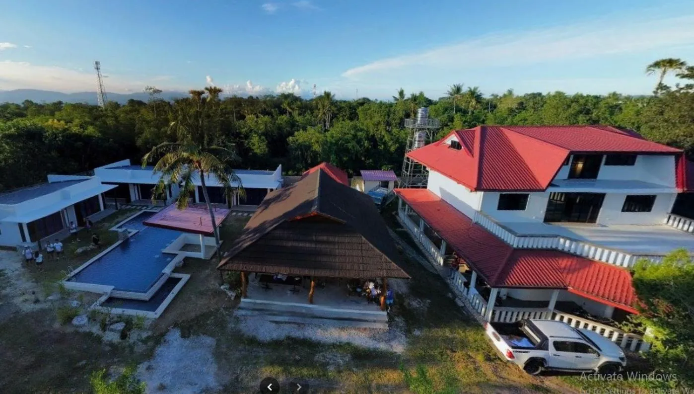 Property building in Bluewaves Hostel & Villa Panagsama by Hiverooms