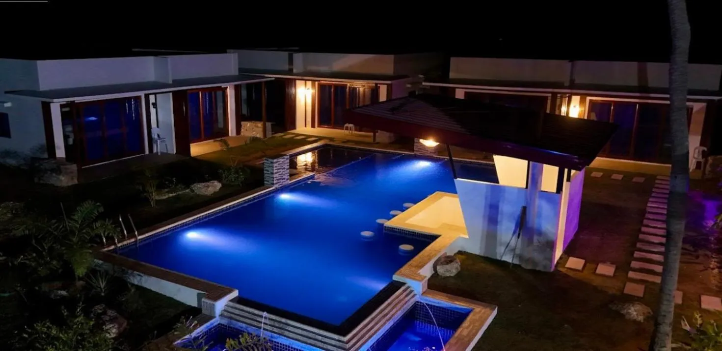 Property building in Bluewaves Hostel & Villa Panagsama by Hiverooms