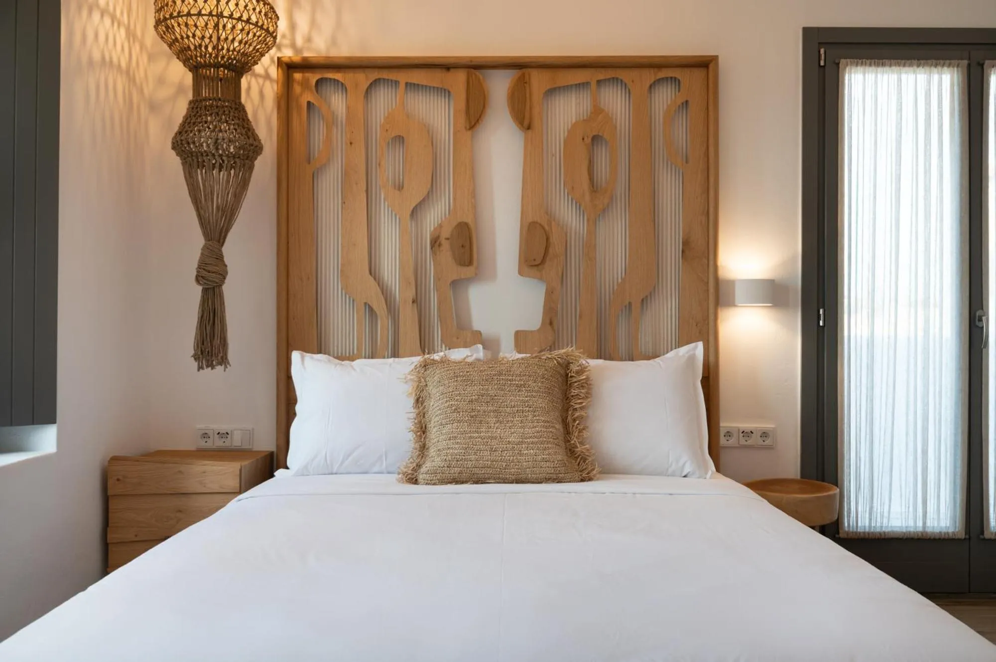 Bed in Kosmitis Suites & Villas