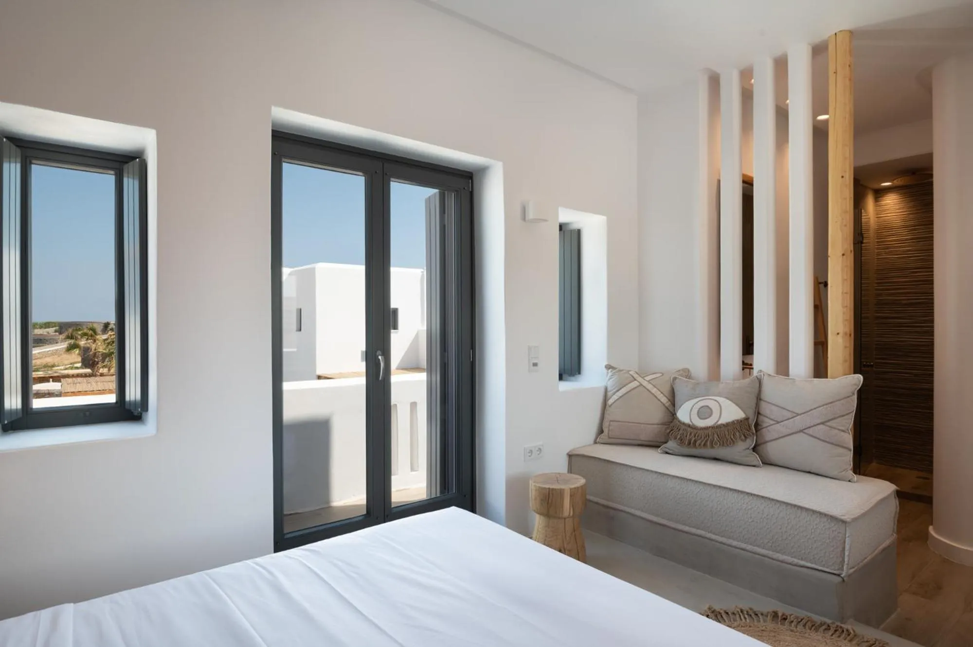 Seating area, Bed in Kosmitis Suites & Villas