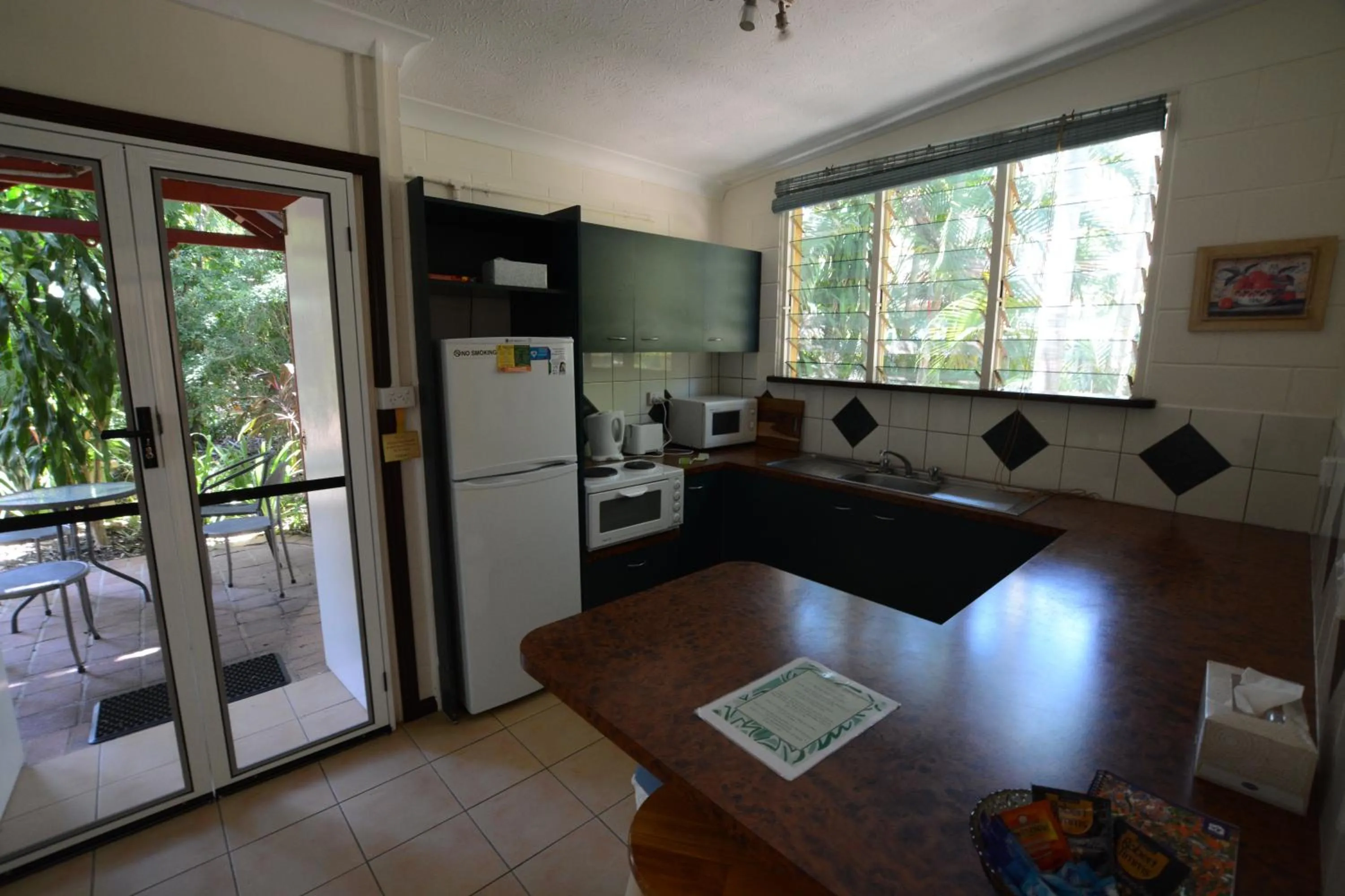 Kitchen or kitchenette in Shambhala Retreat Magnetic Island Cottages