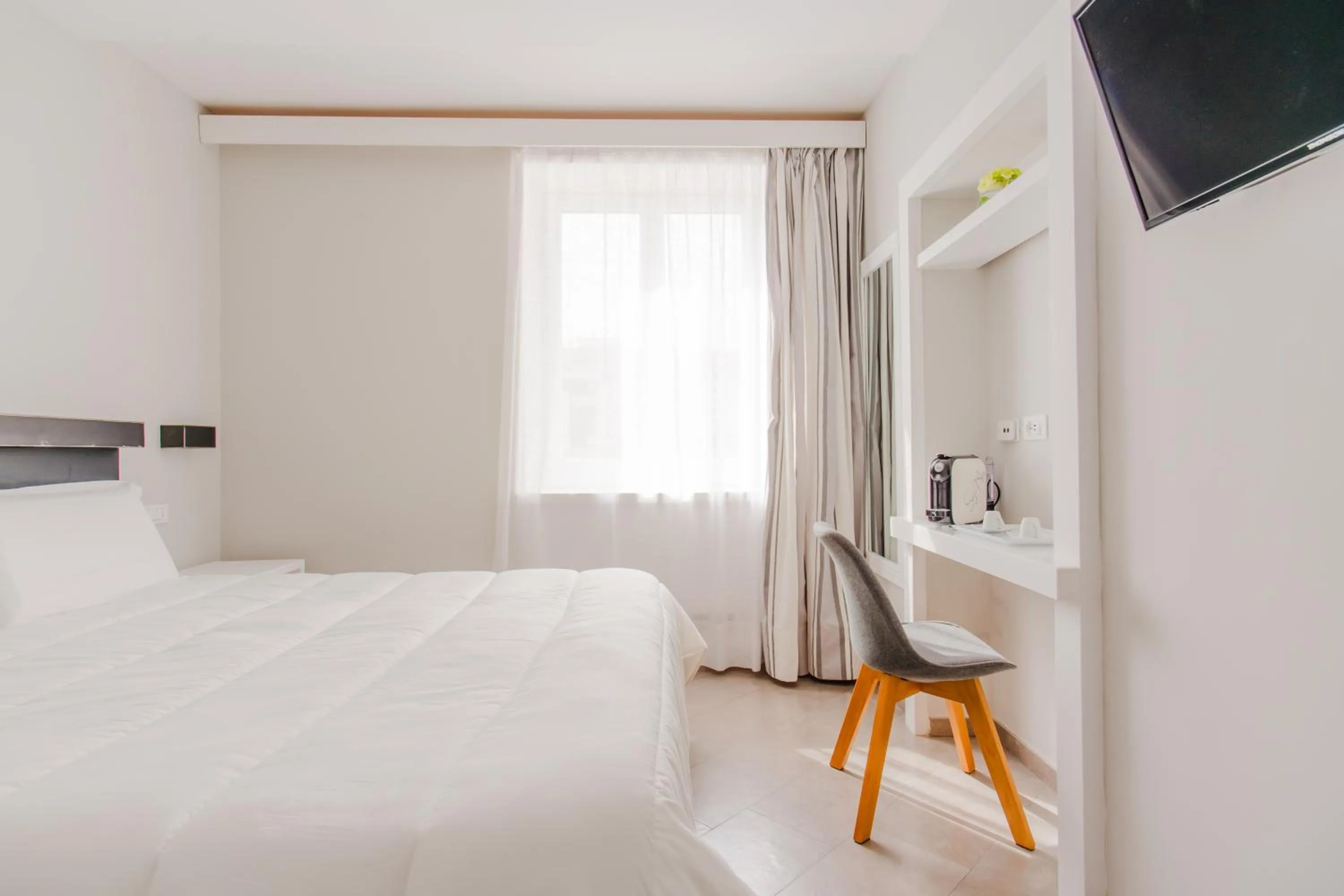 Bed in Palazzo Gargiulo Luxury Rooms & Suites