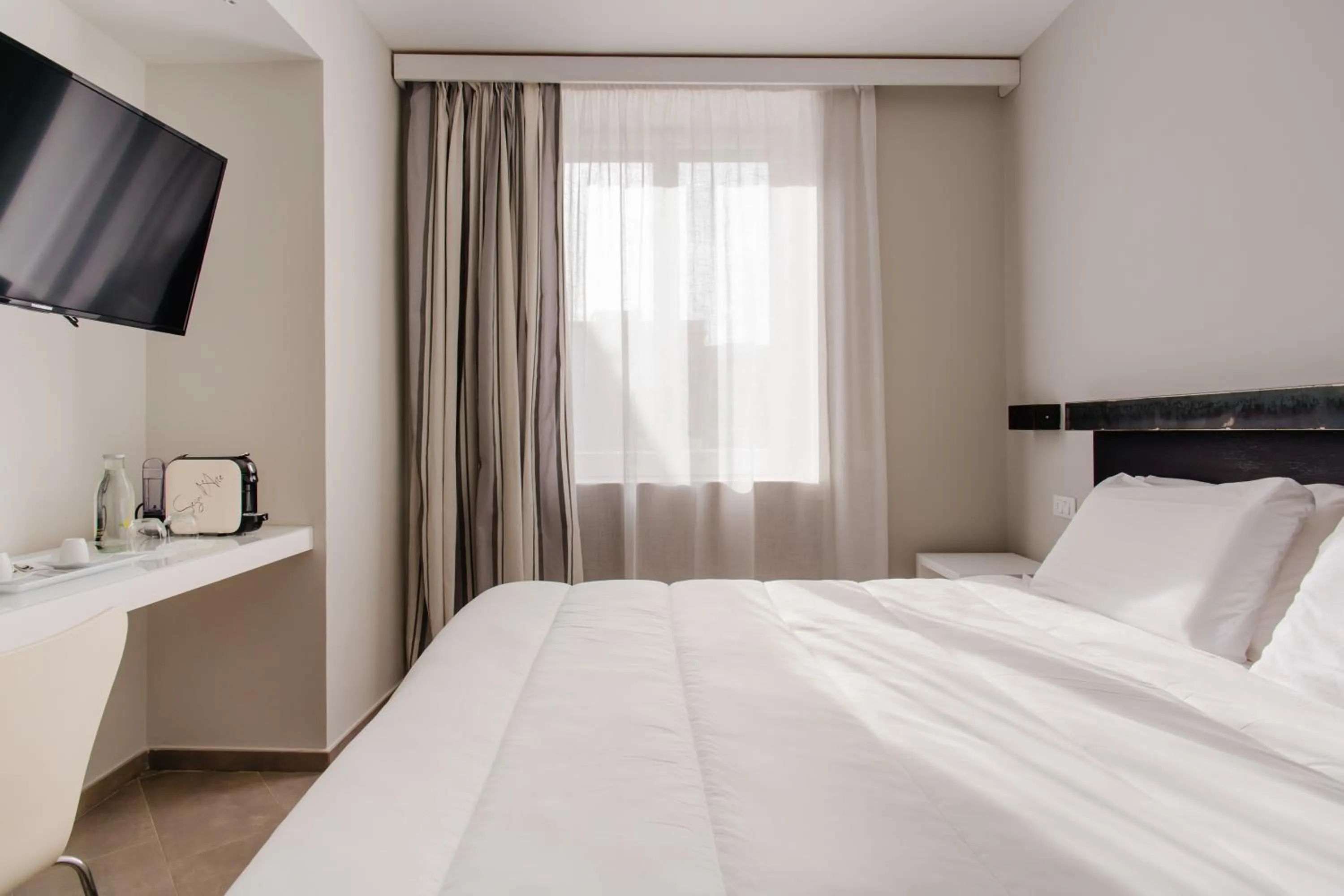 Bed in Palazzo Gargiulo Luxury Rooms & Suites