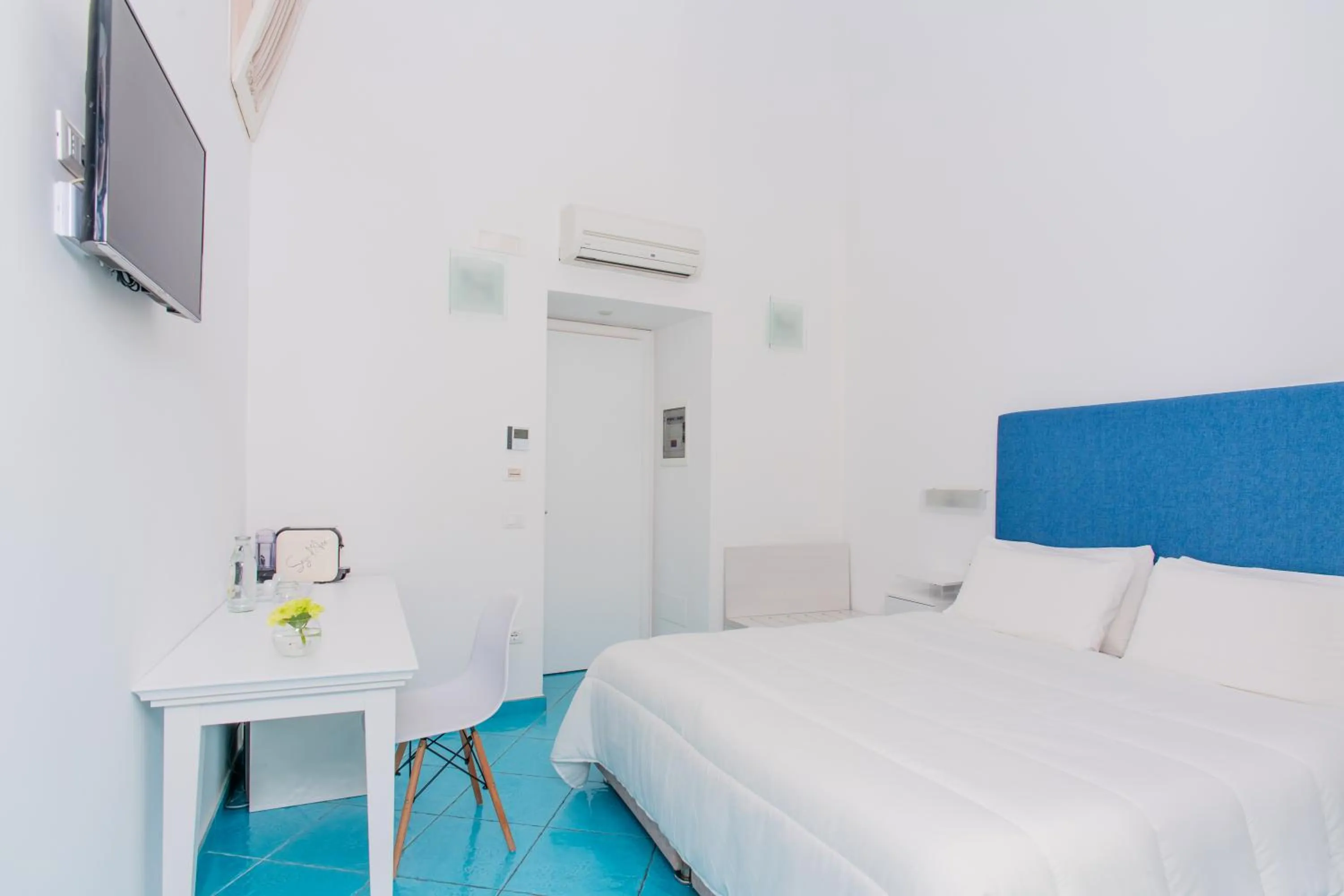 Bed in Palazzo Gargiulo Luxury Rooms & Suites