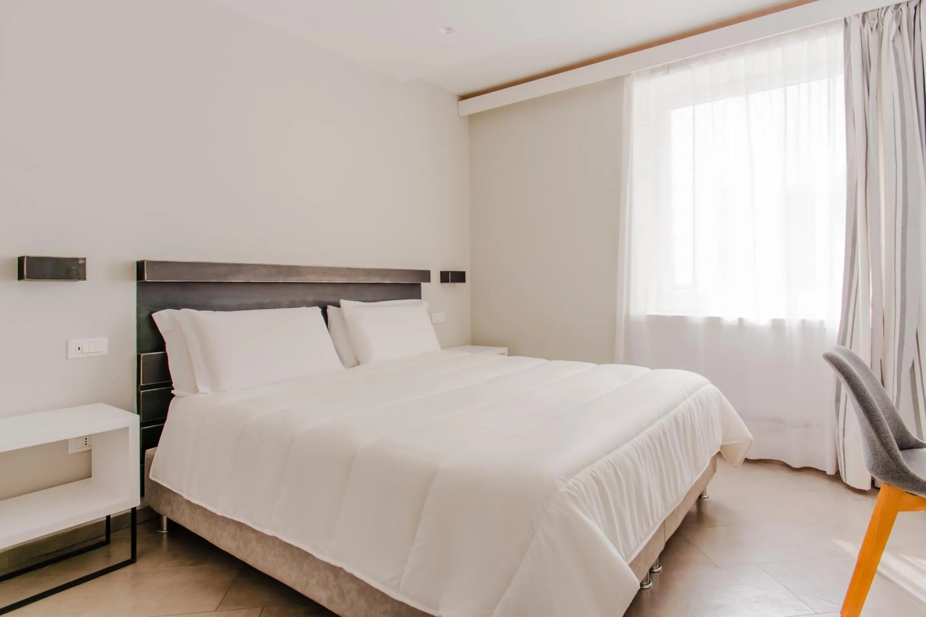 Bed in Palazzo Gargiulo Luxury Rooms & Suites