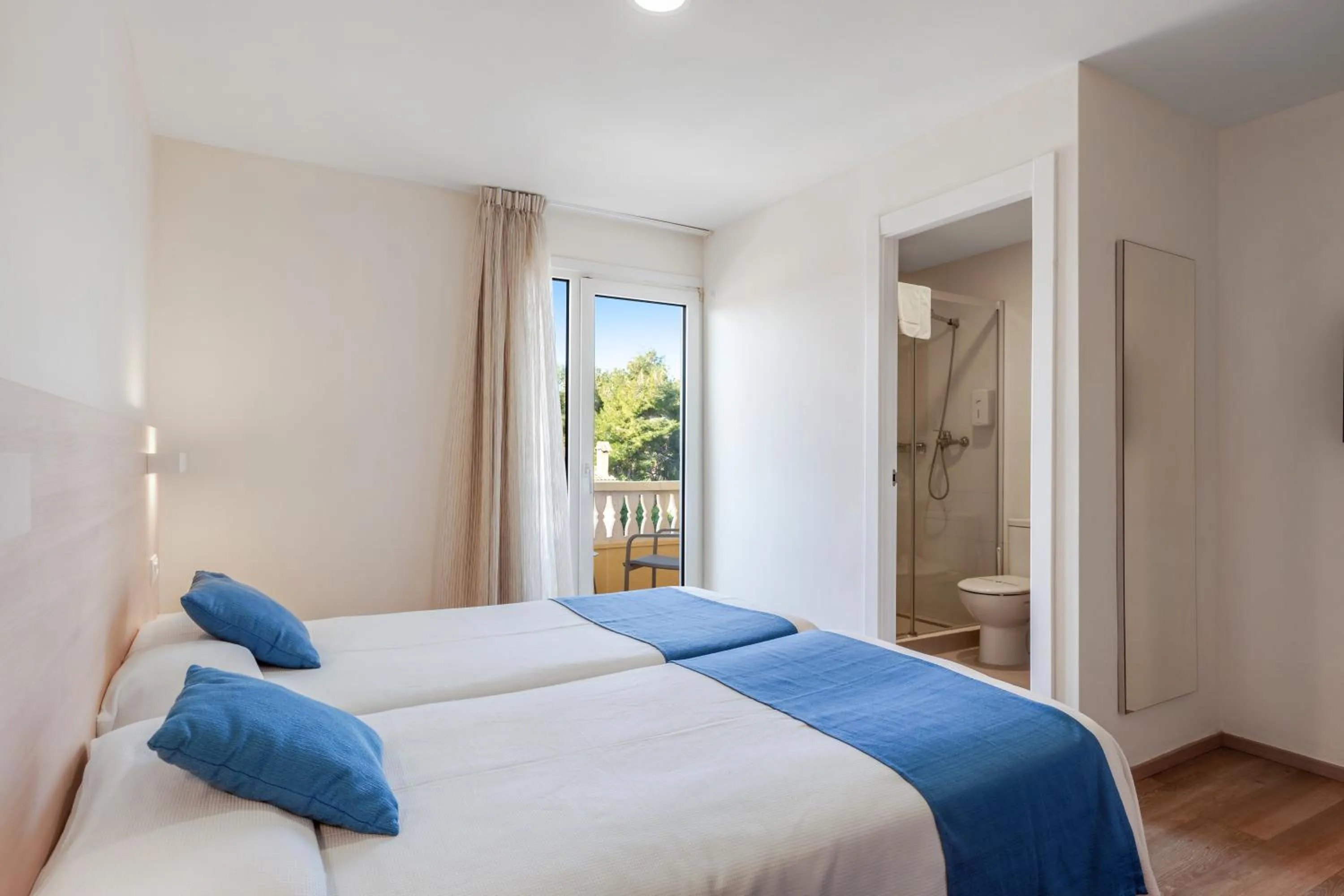 Bed in Bluewater Hotel