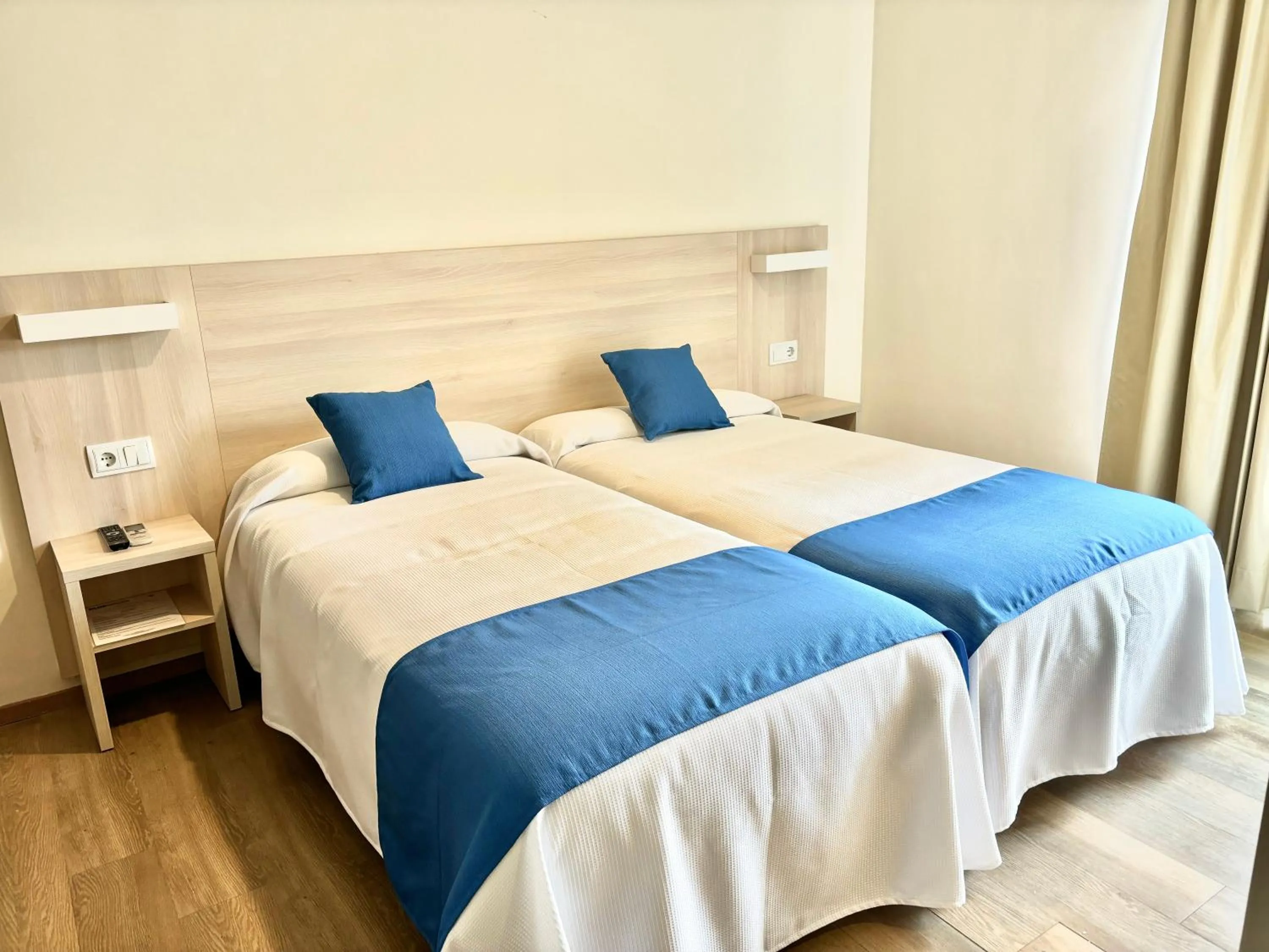 Bed in Bluewater Hotel