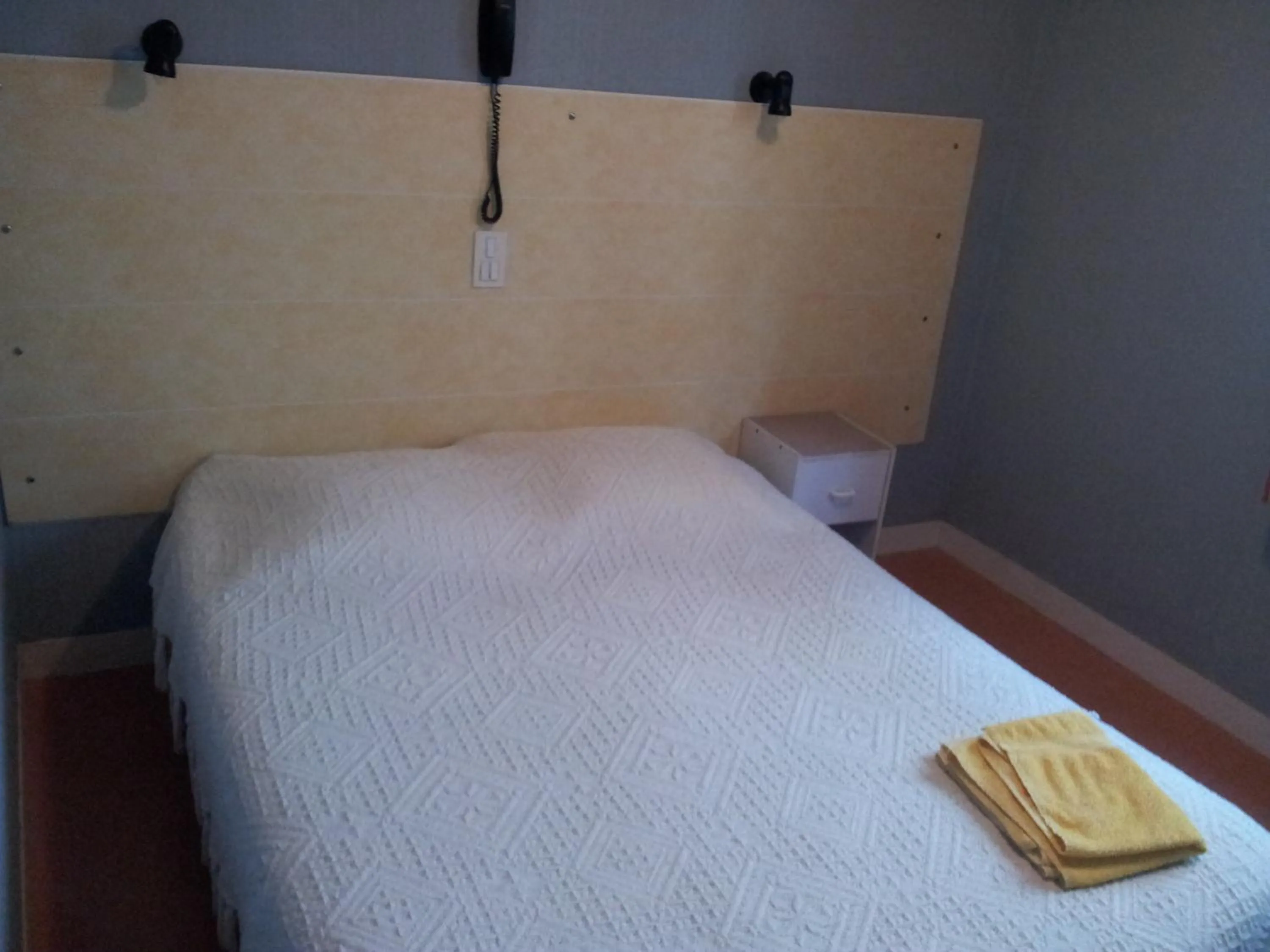 Bedroom in Hôtel du Terrage