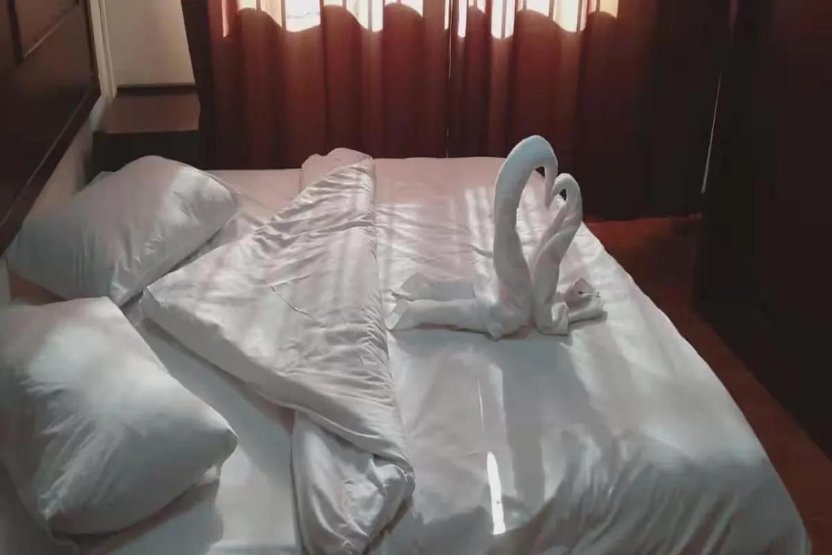 Bed in Al-Nujoom Hotel Suites