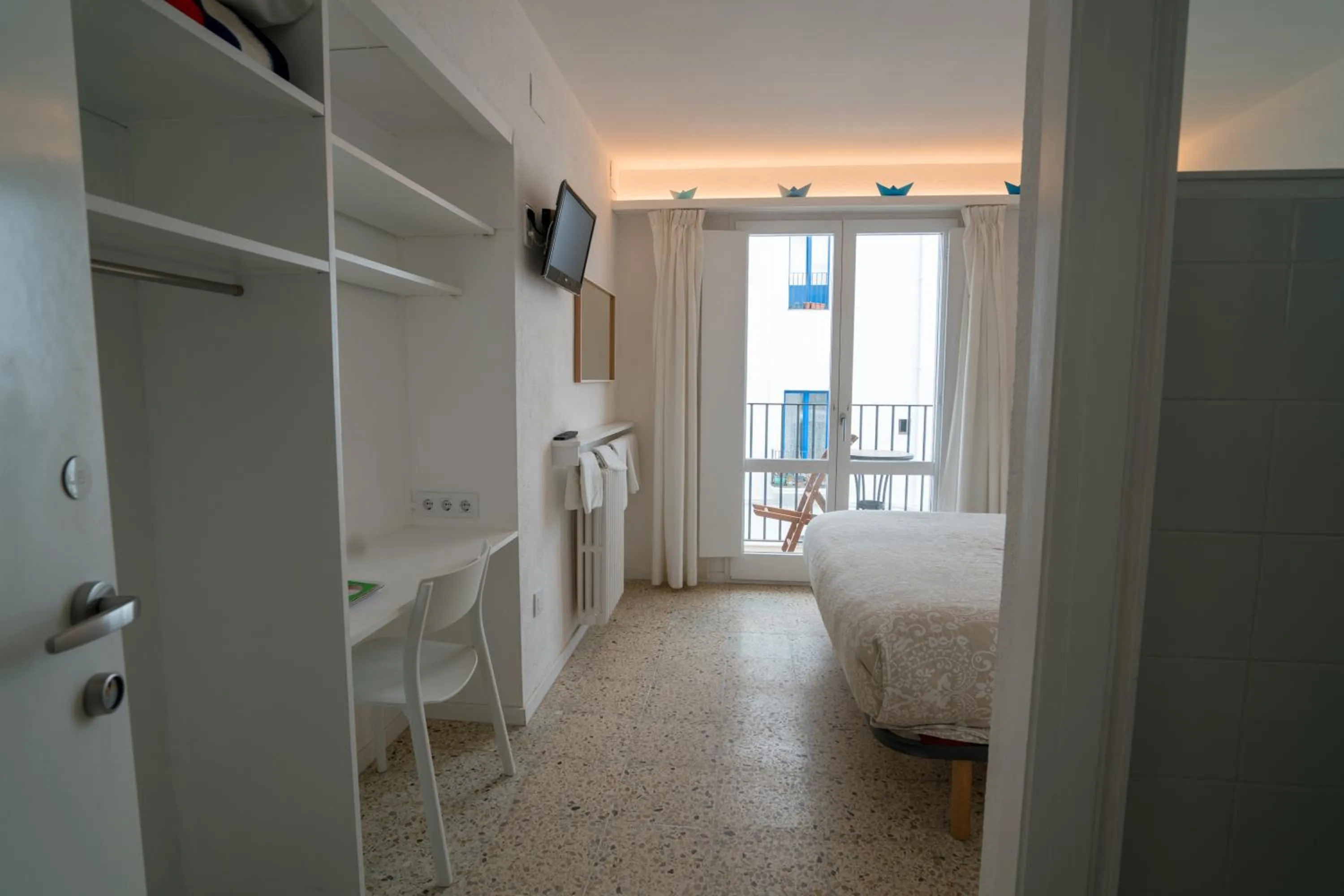 Photo of the whole room, Bed in Hostal Marina Cadaqués