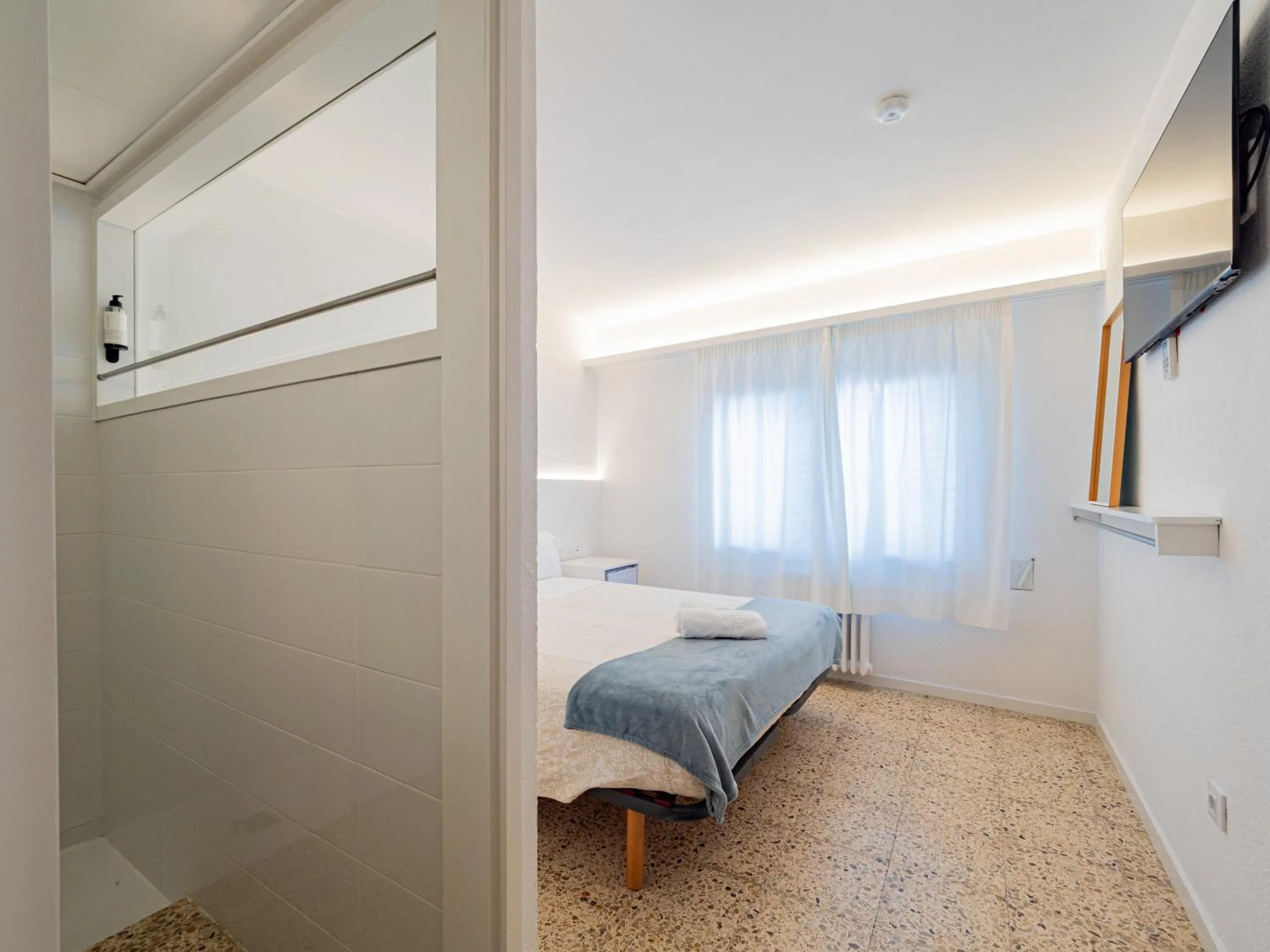 Photo of the whole room, Bed in Hostal Marina Cadaqués