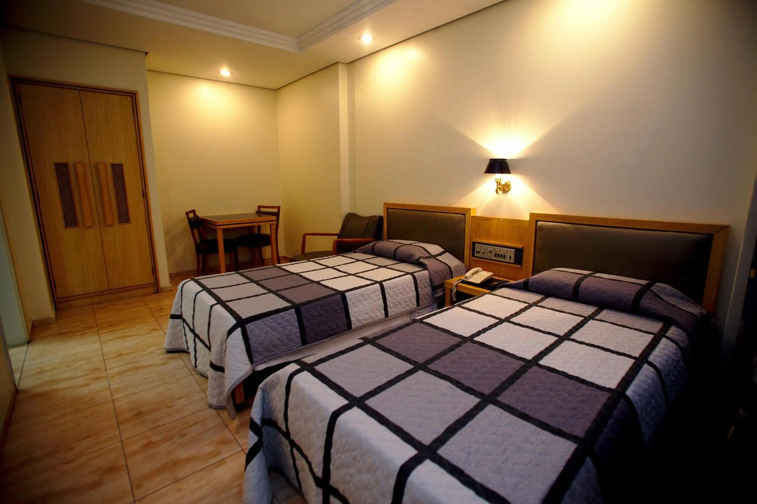 Bed in Hotel Columbia