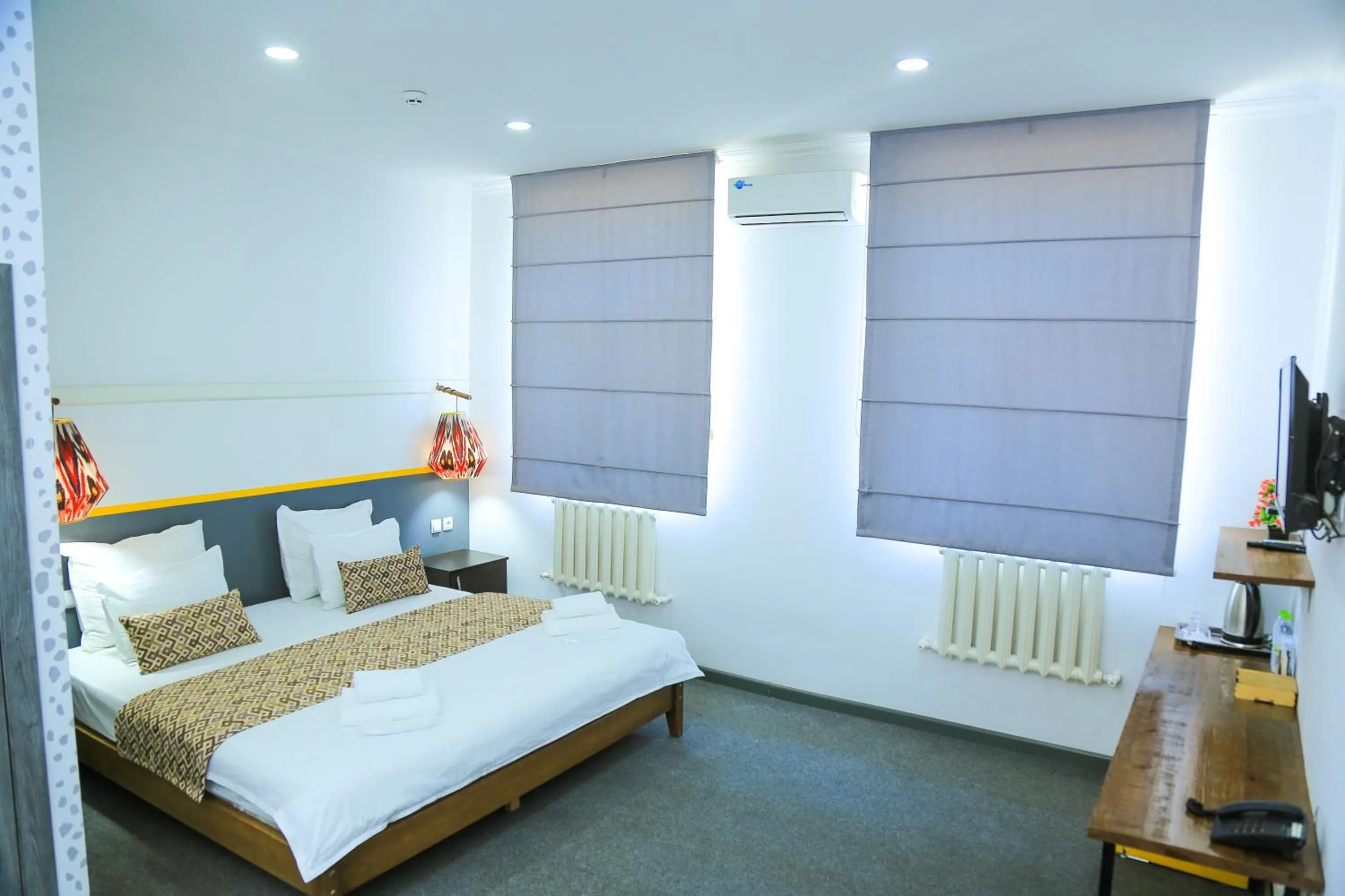 Bed in ART SAMARQAND hotel