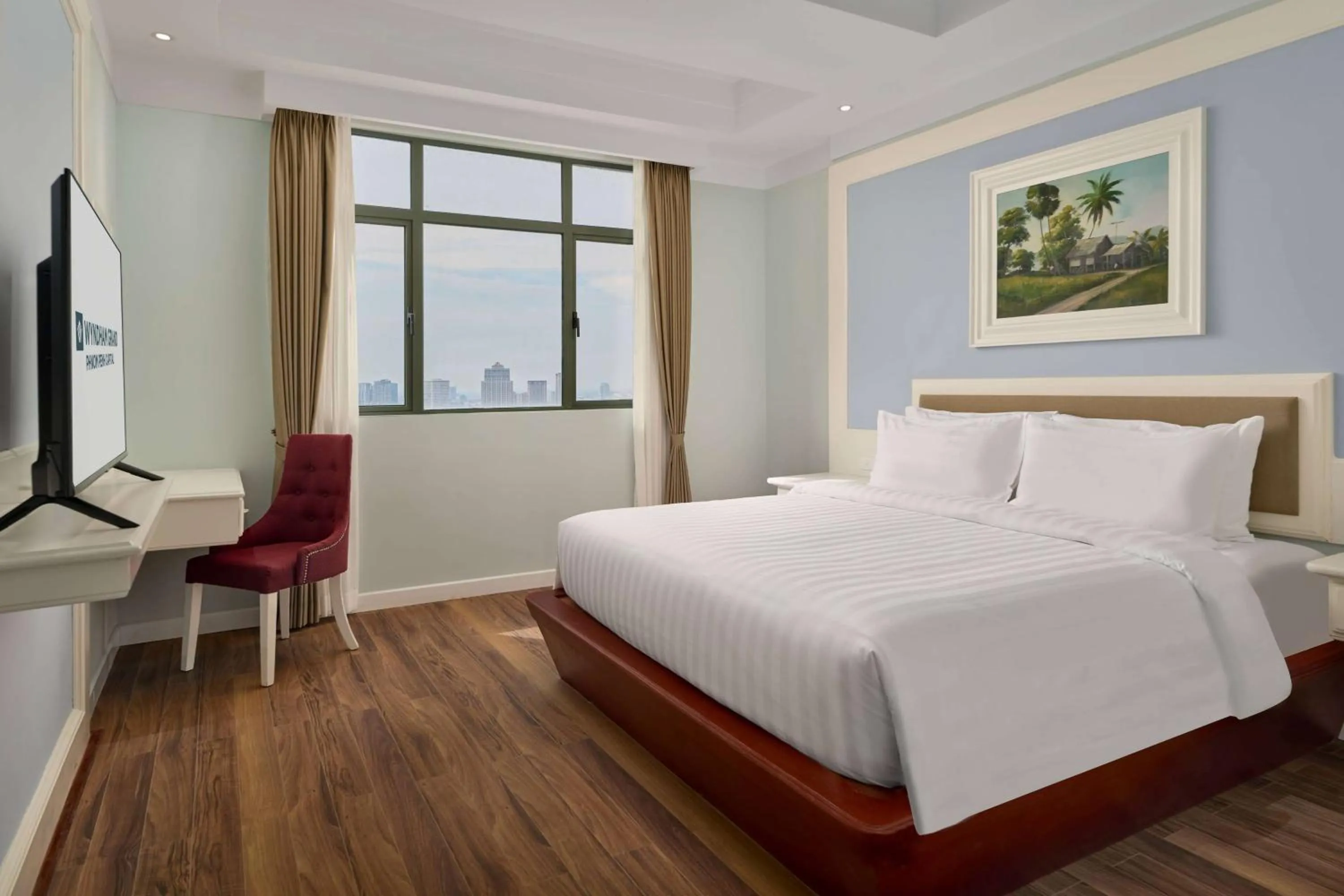 Bed in Wyndham Grand Phnom Penh Capital
