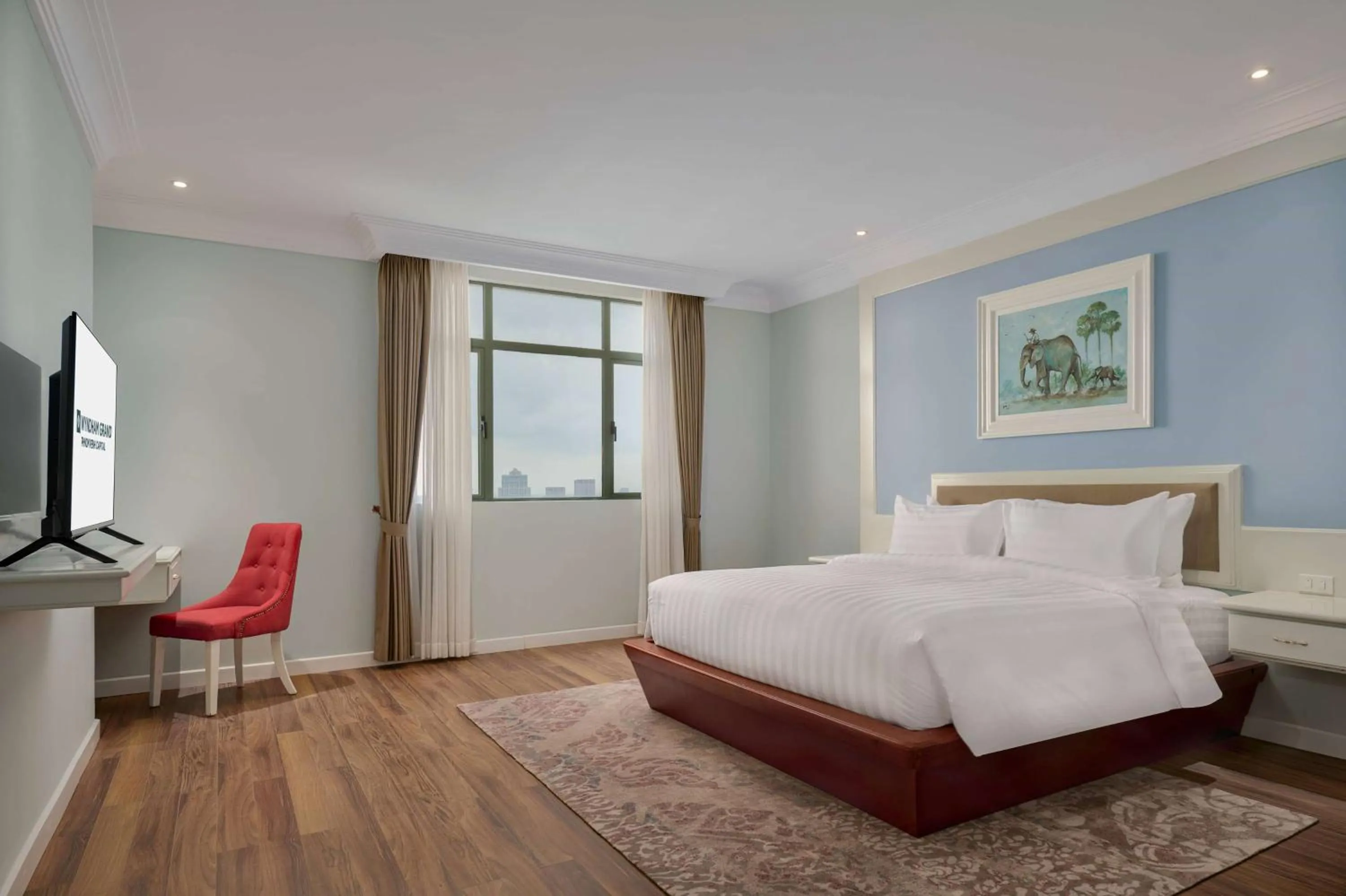 Photo of the whole room, Bed in Wyndham Grand Phnom Penh Capital