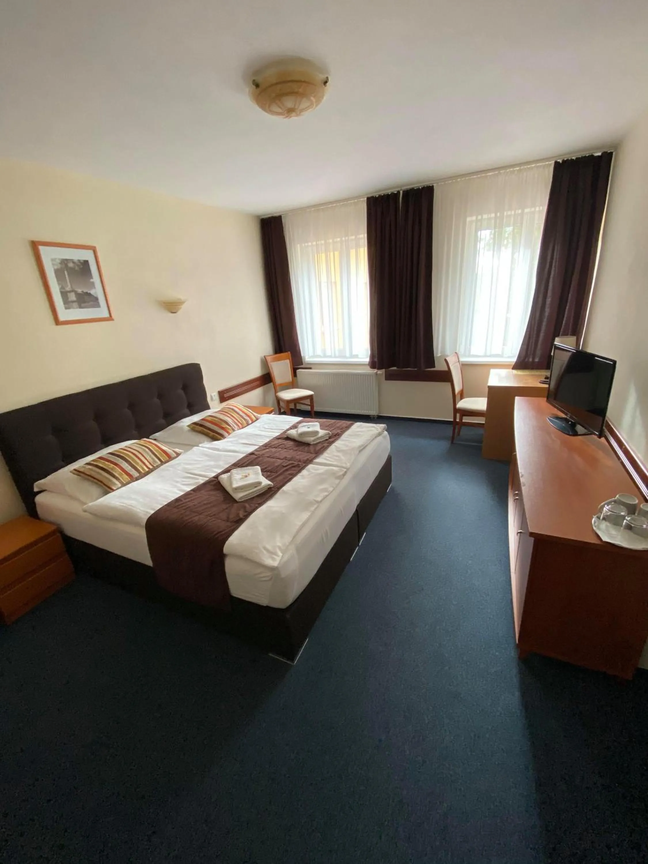 Bed in Garni Hotel Tatramonti