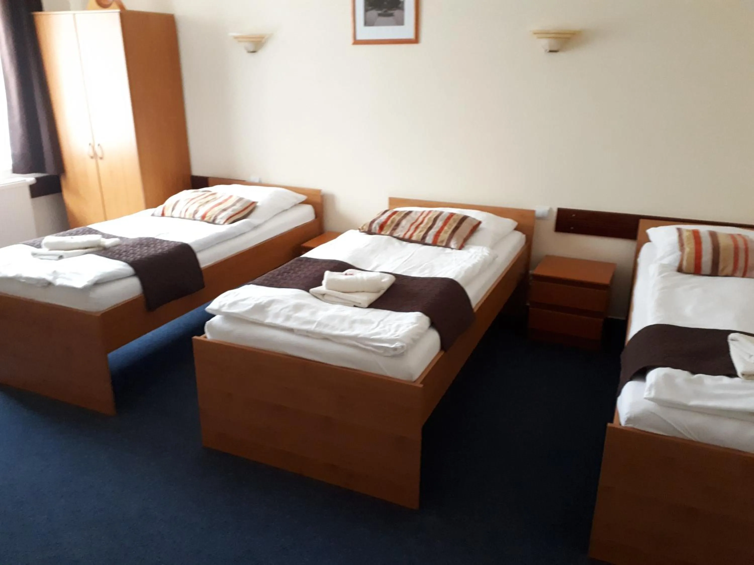 Bed in Garni Hotel Tatramonti