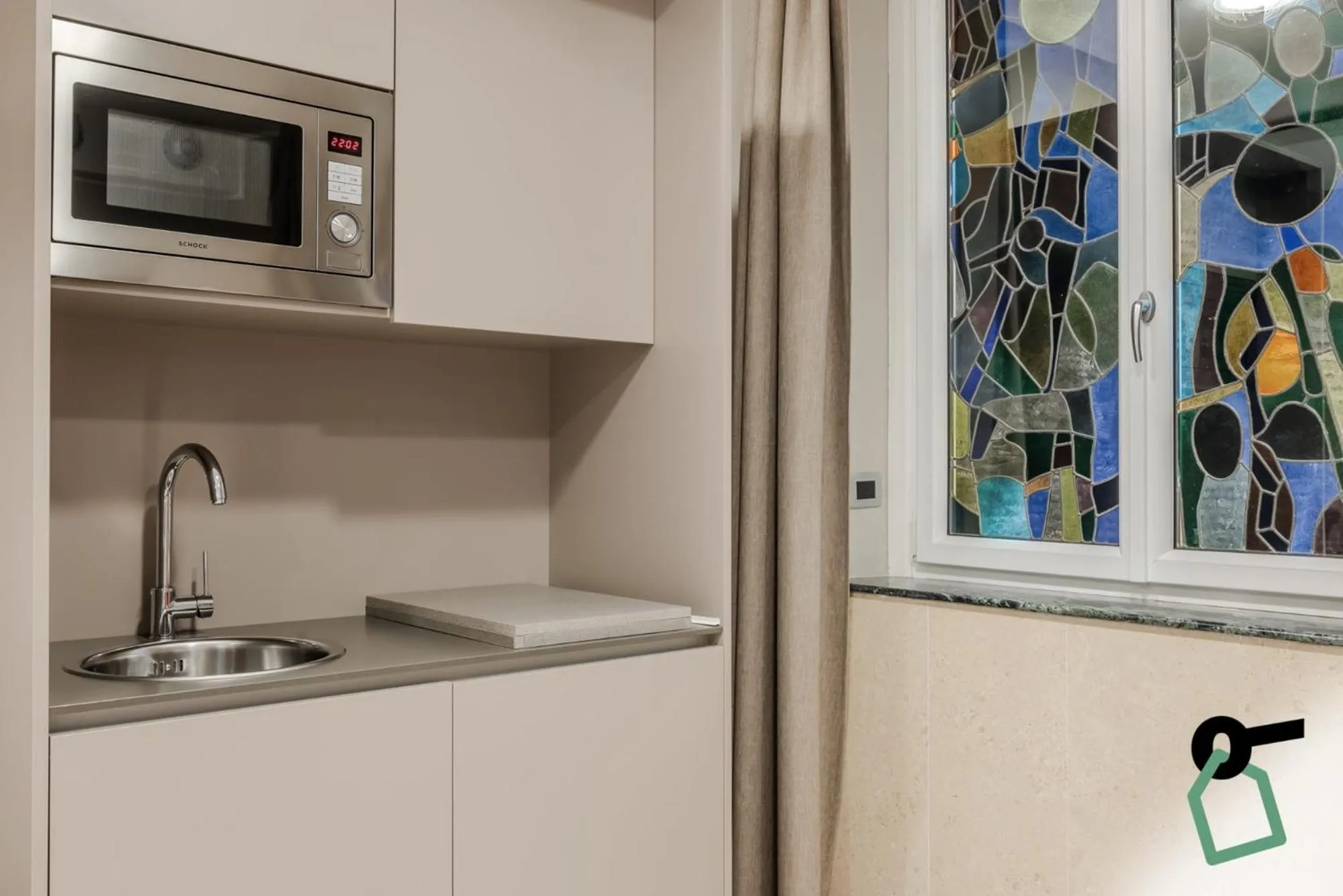 Kitchen or kitchenette in Hotiday Apartments La Spezia
