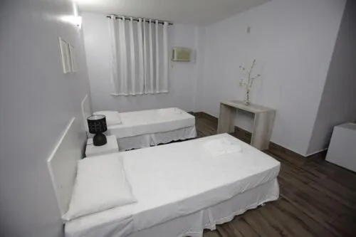 Bed in Iguassu Flats Hotel