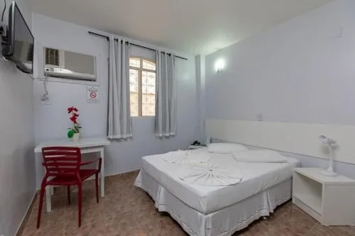 Bed in Iguassu Flats Hotel