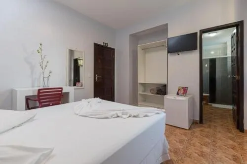 Bed in Iguassu Flats Hotel