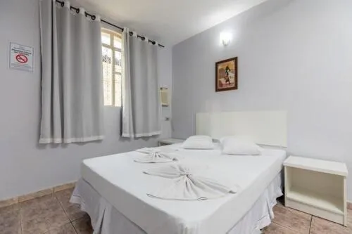 Bed in Iguassu Flats Hotel