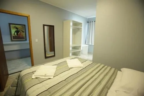 Bed in Iguassu Flats Hotel