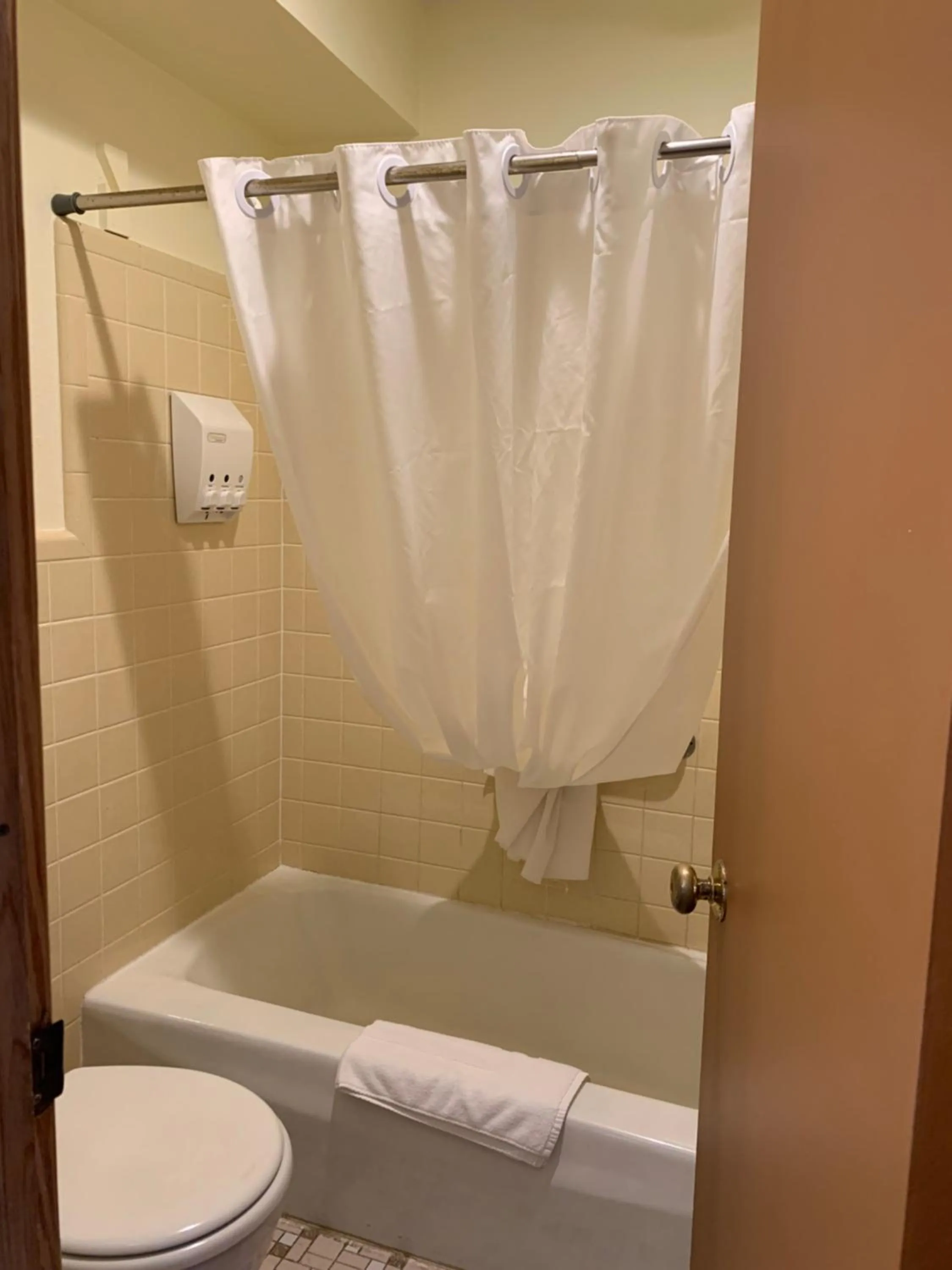 Toilet in Cape Pines Motel