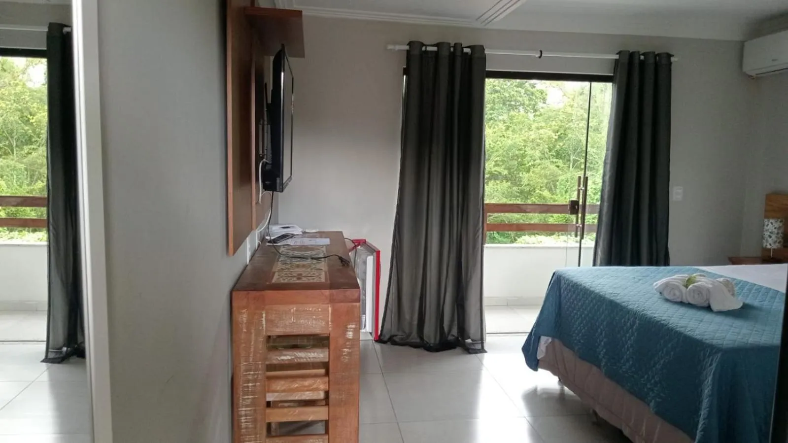 Bed in Pousada Casa do Bosque