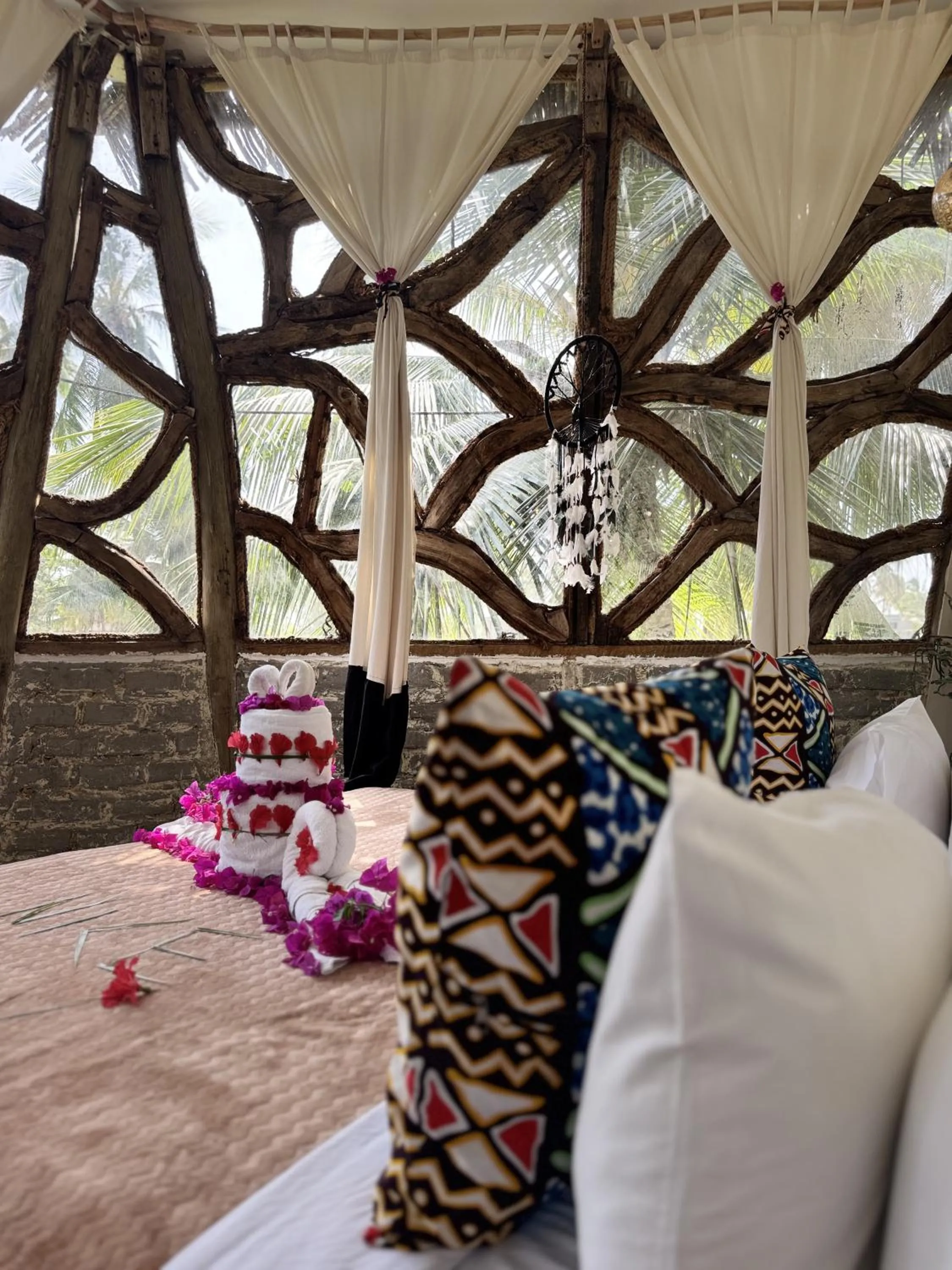 Bed in The Nest Tropical Oasis Resort