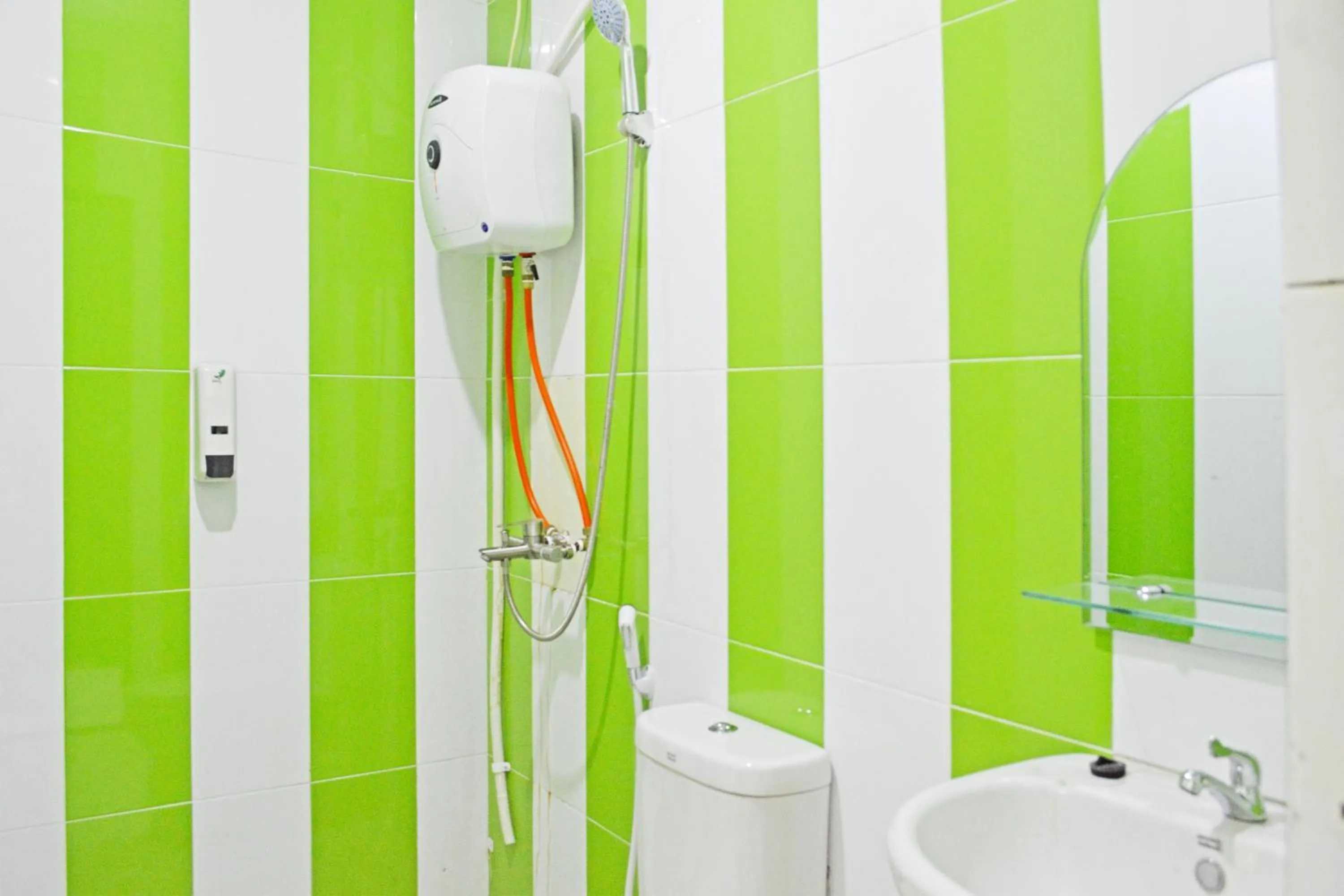 Bathroom in Collection O Balikpapan Near Balikpapan Super Block Formerly City Inn Hotel