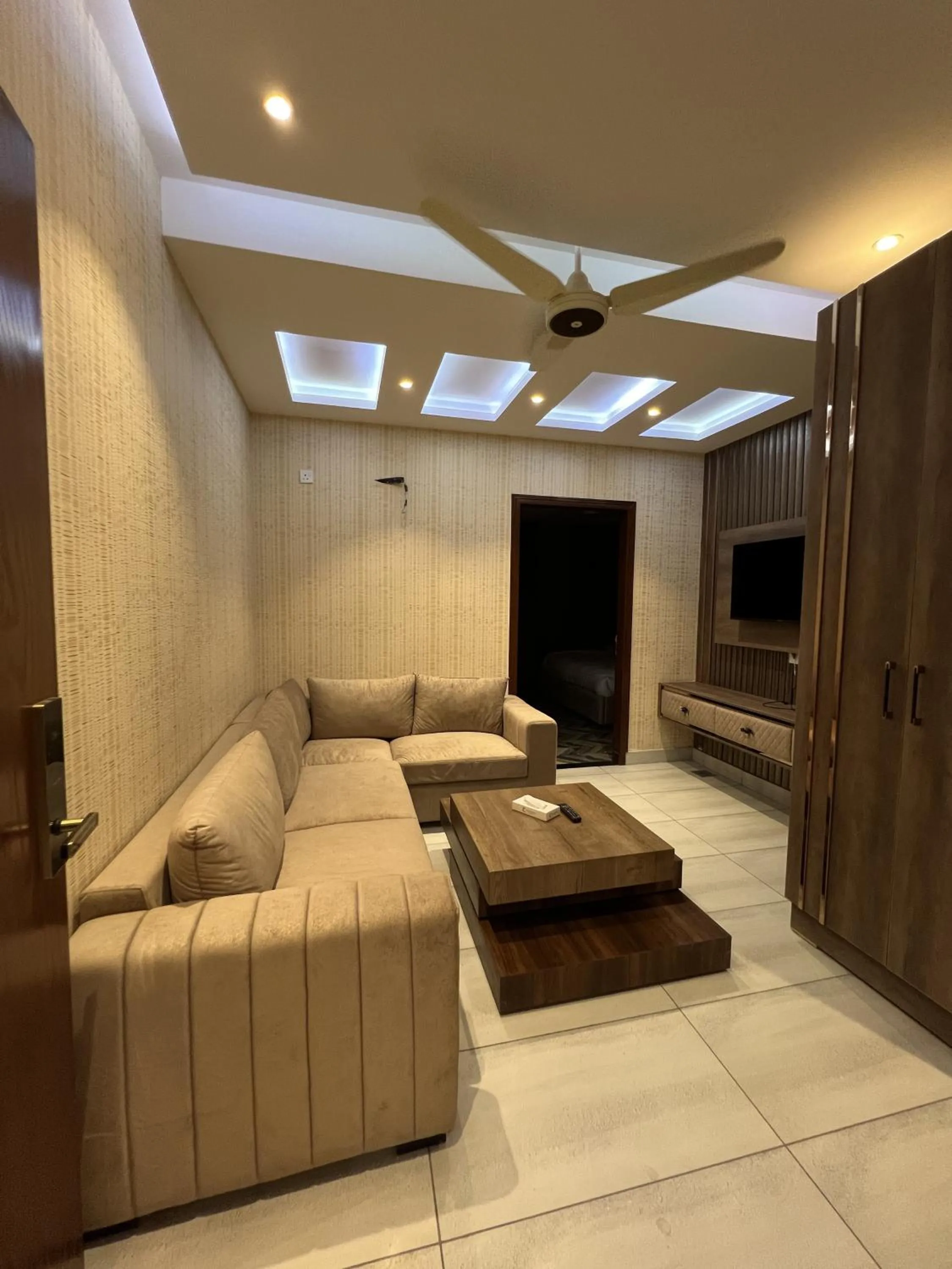 Communal lounge/ TV room in Courteous Hotel