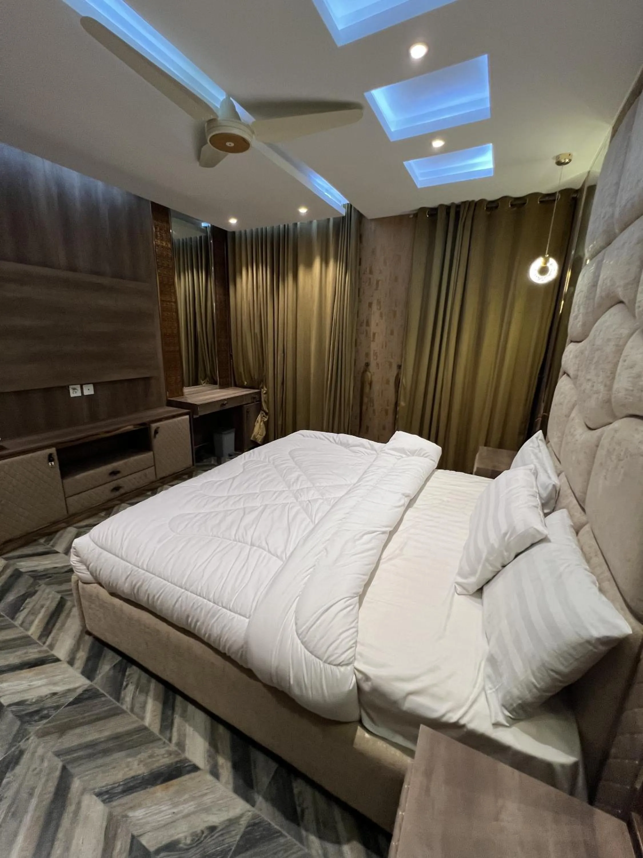 Bed in Courteous Hotel