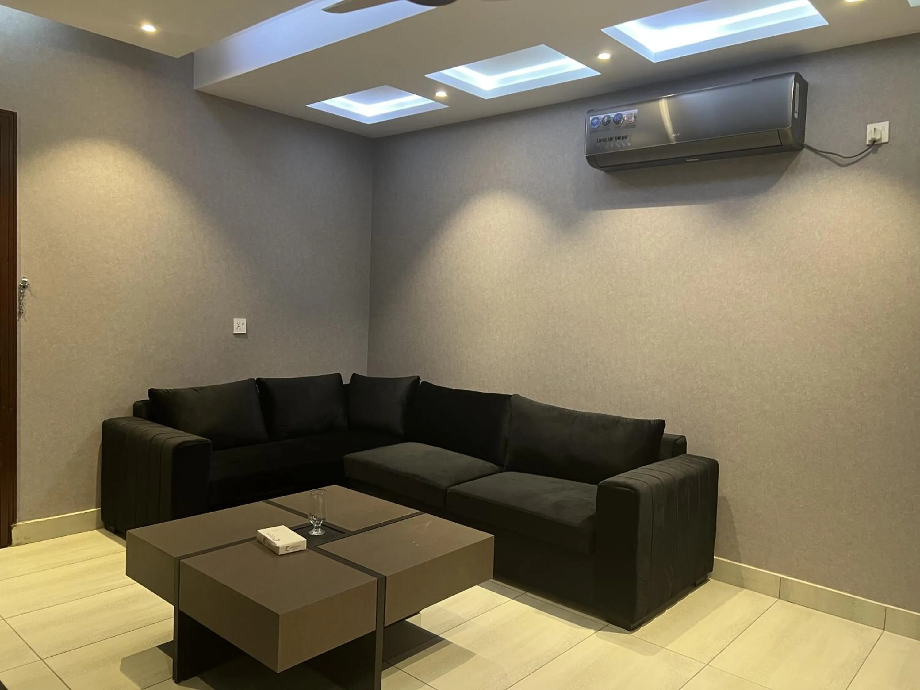 Communal lounge/ TV room in Courteous Hotel