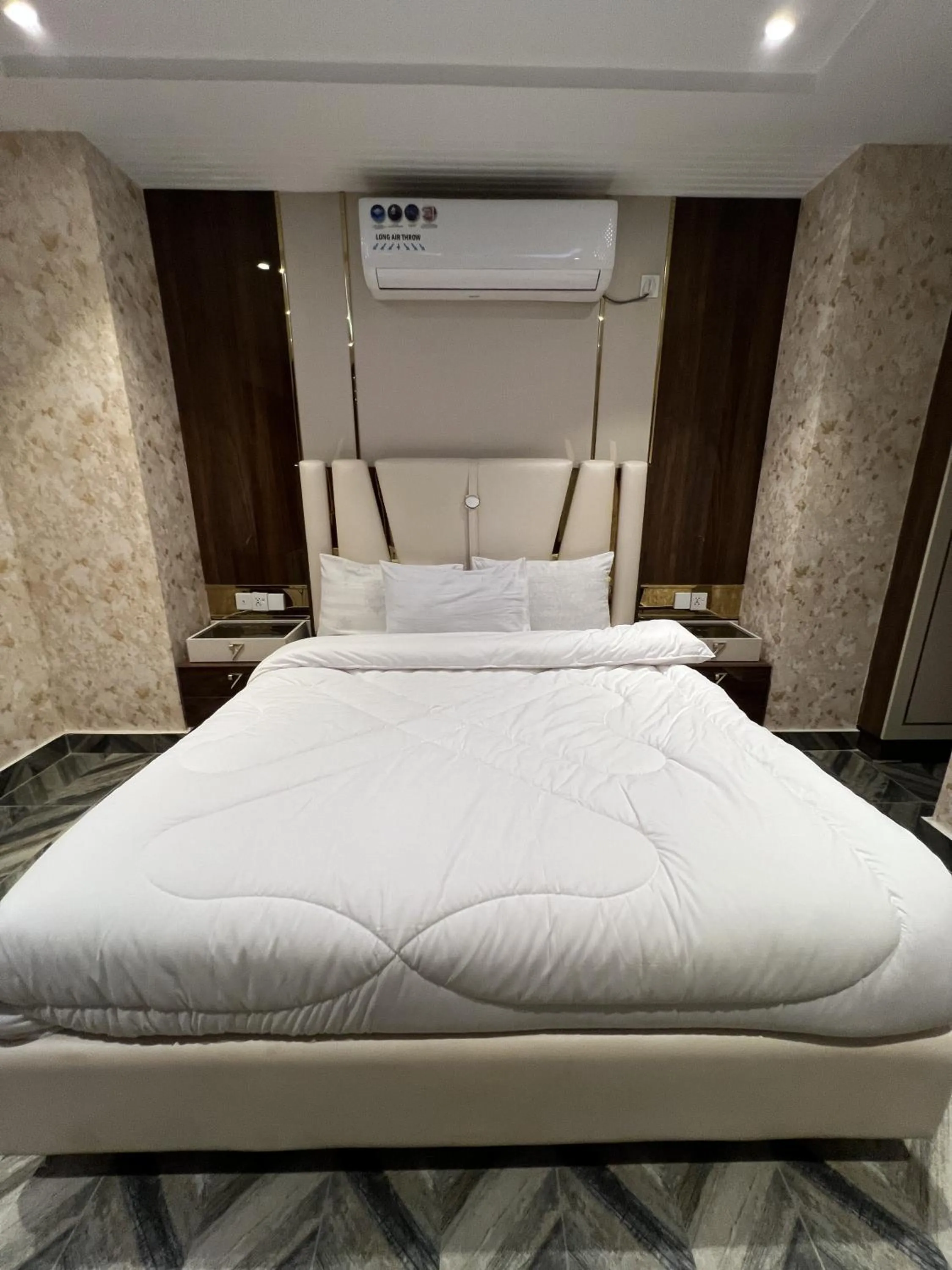 Bed in Courteous Hotel