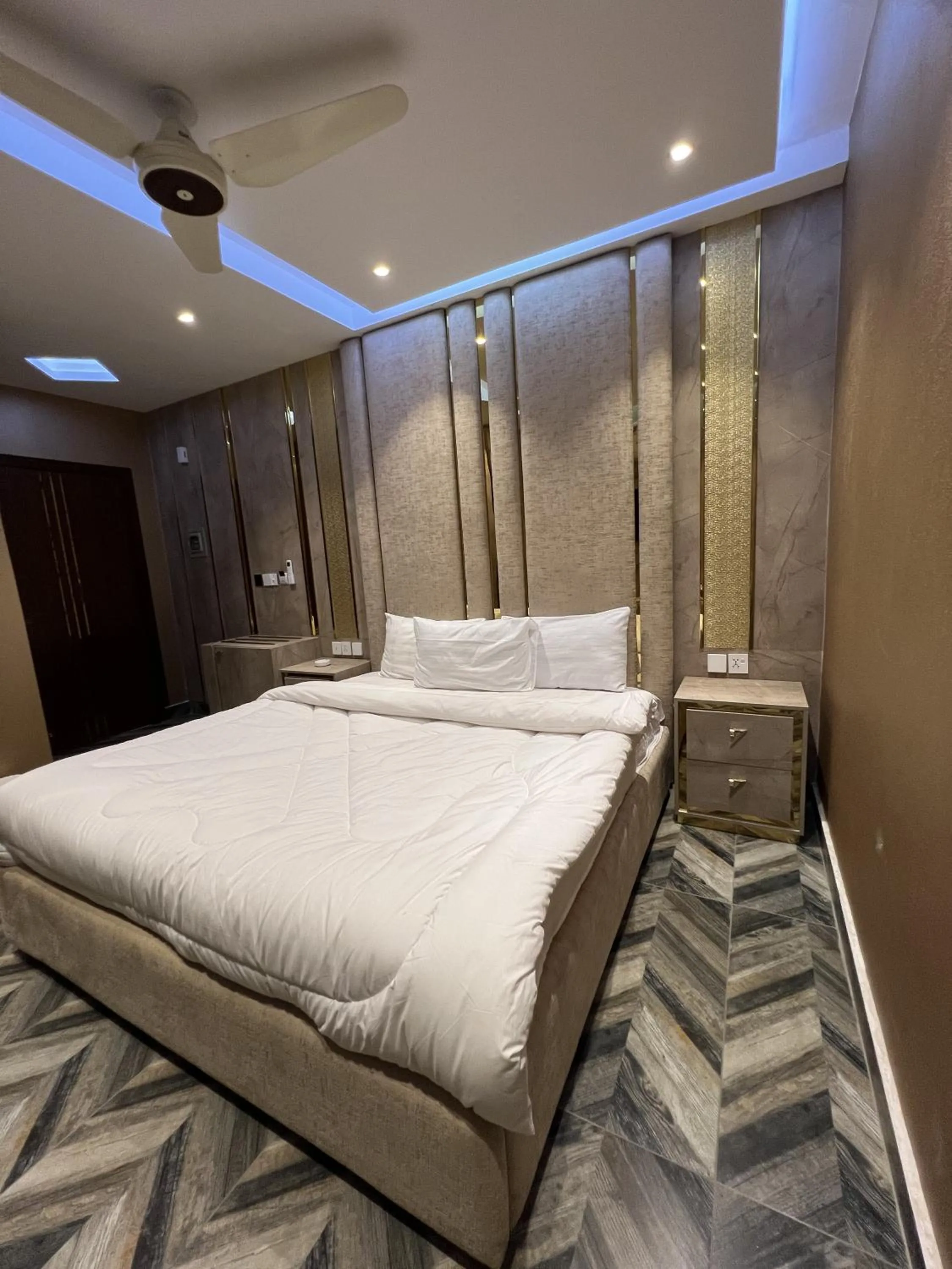 Bed in Courteous Hotel