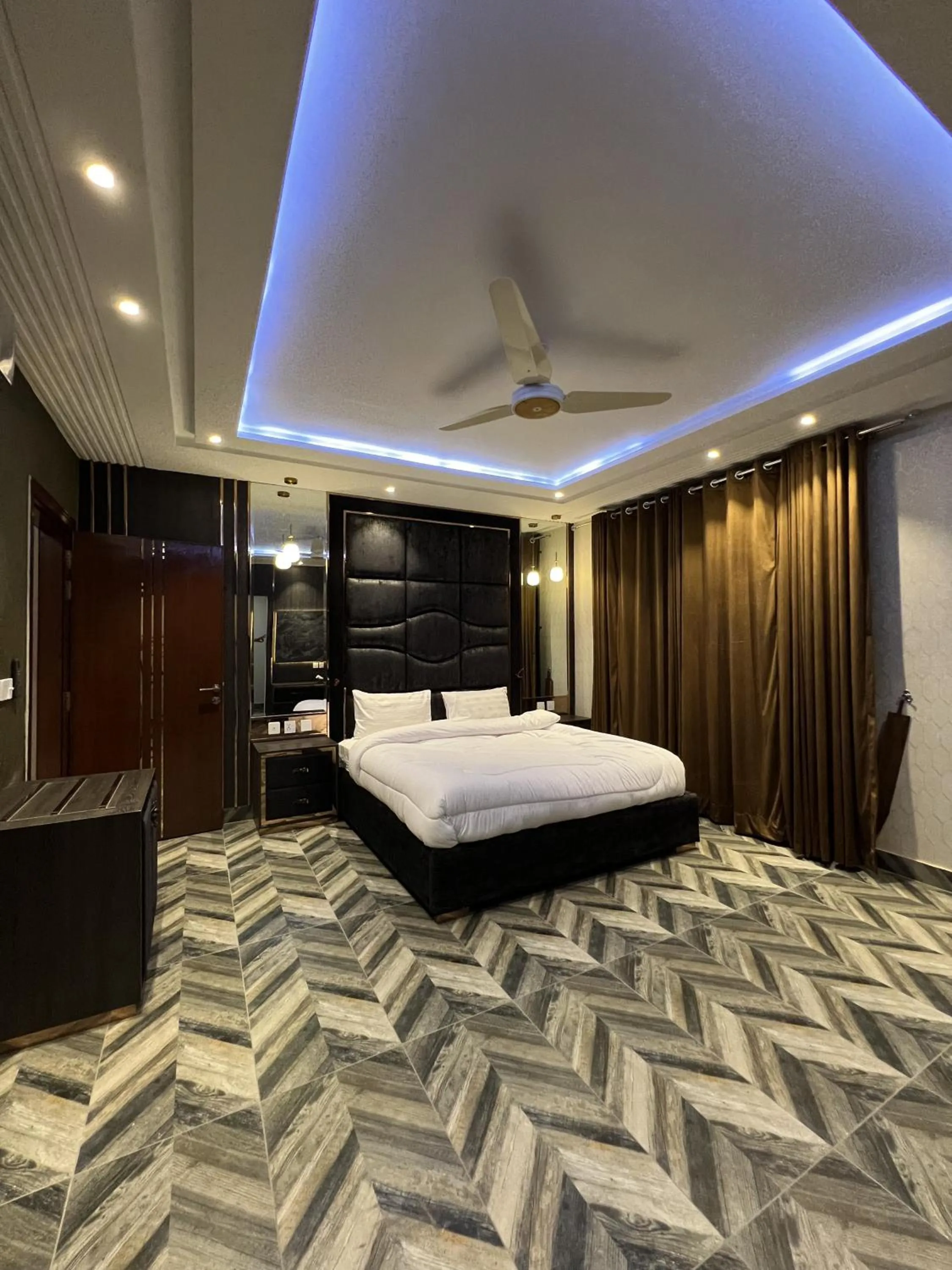 Bed in Courteous Hotel