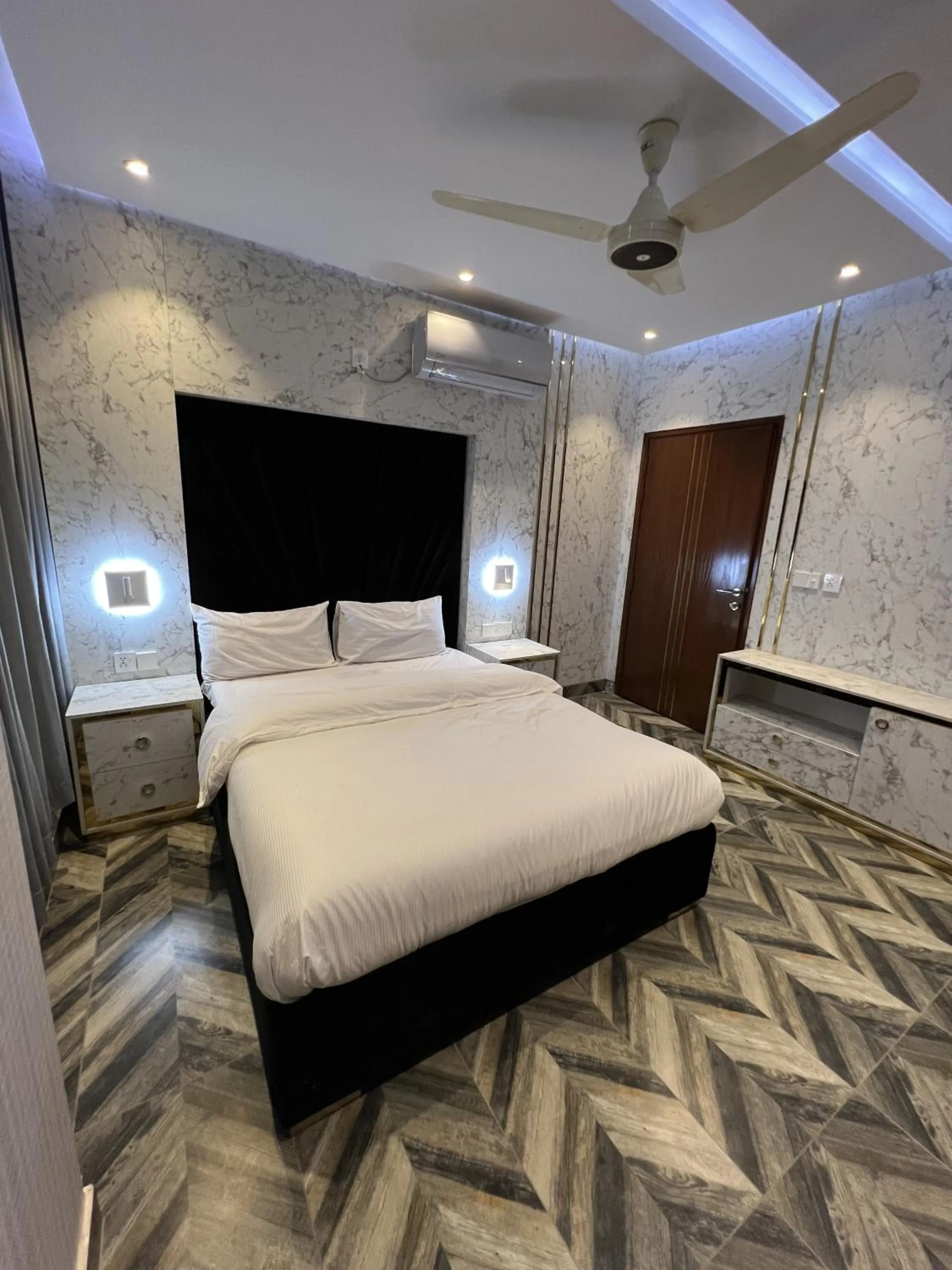 Bed in Courteous Hotel