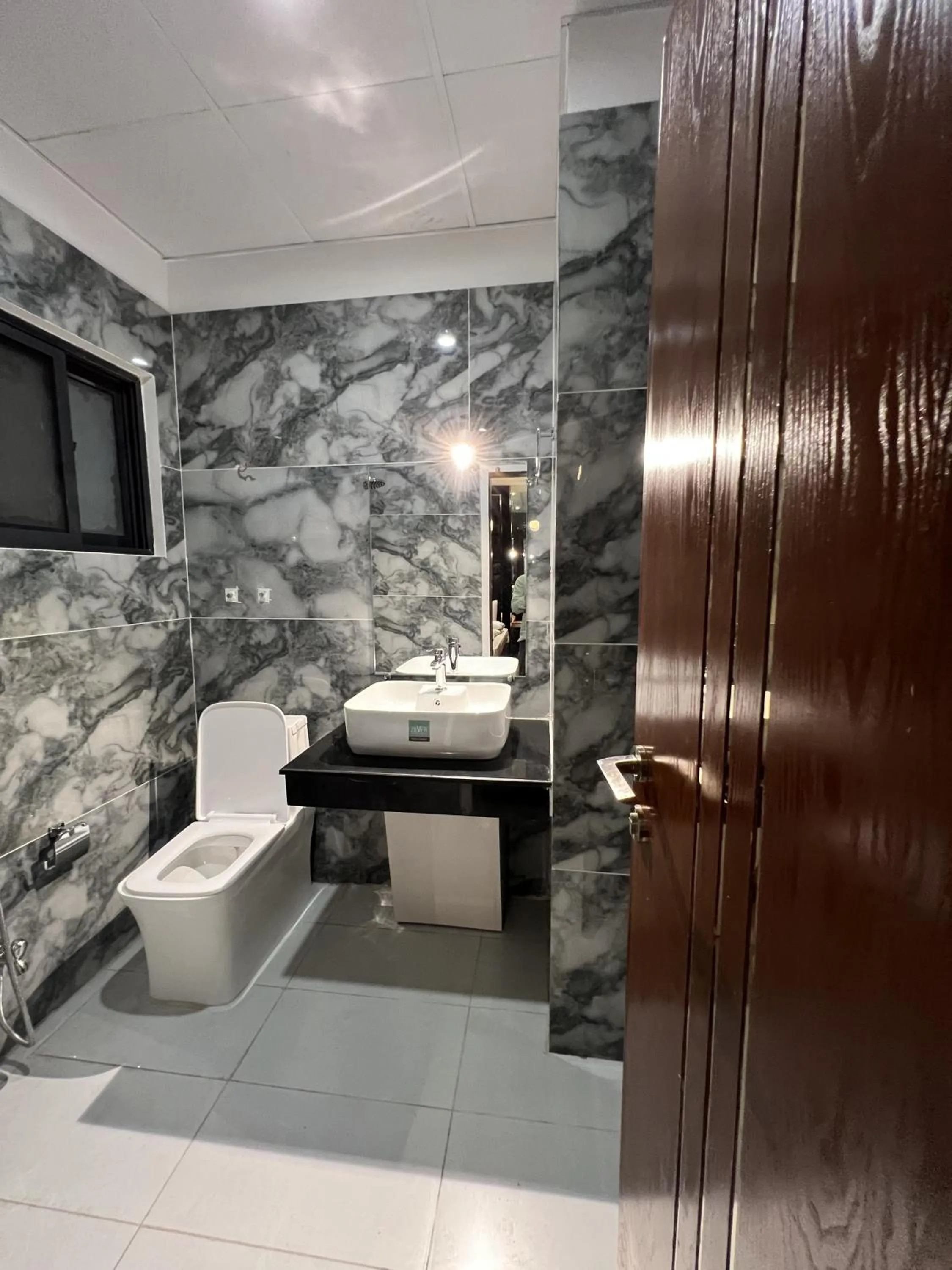 Toilet in Courteous Hotel