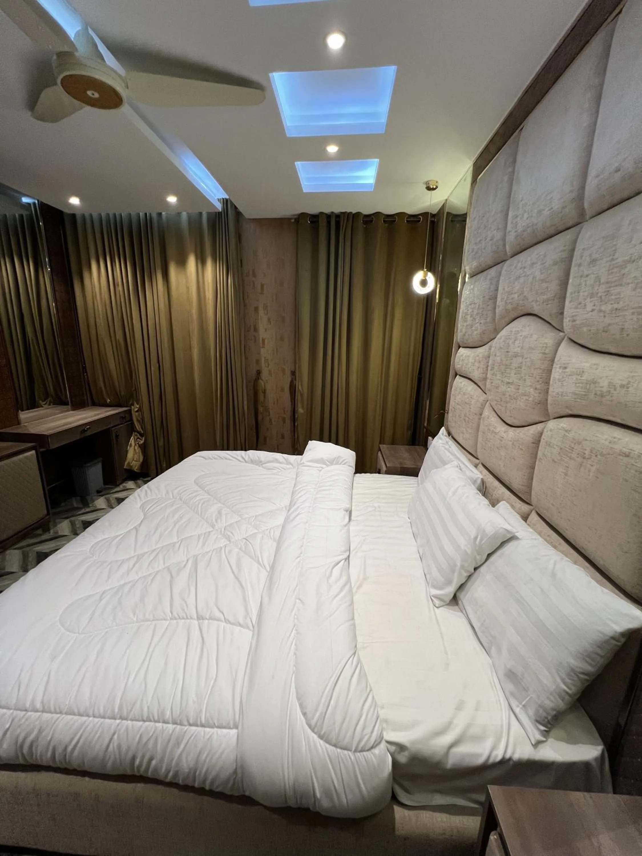 Bed in Courteous Hotel