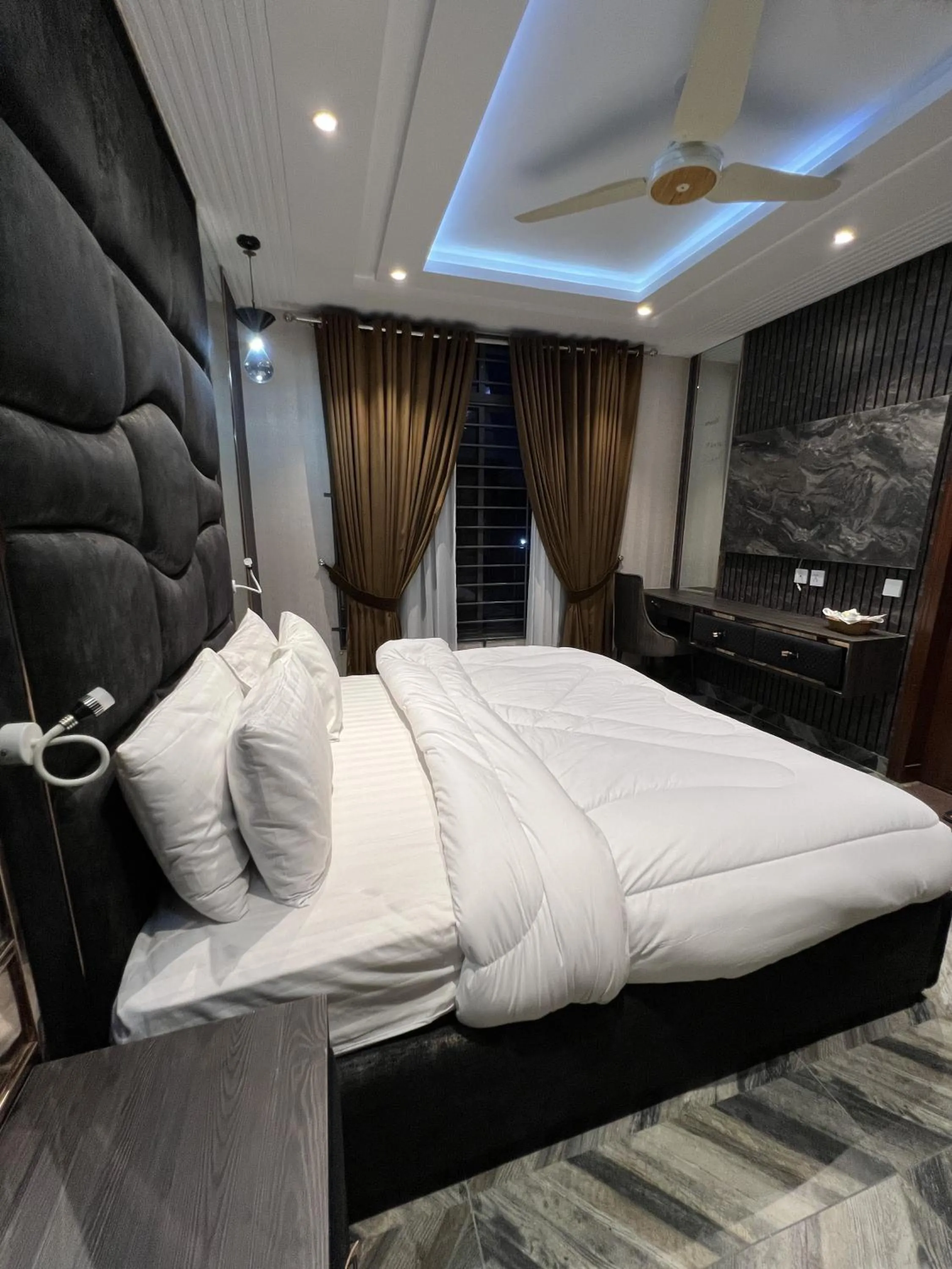 Bed in Courteous Hotel