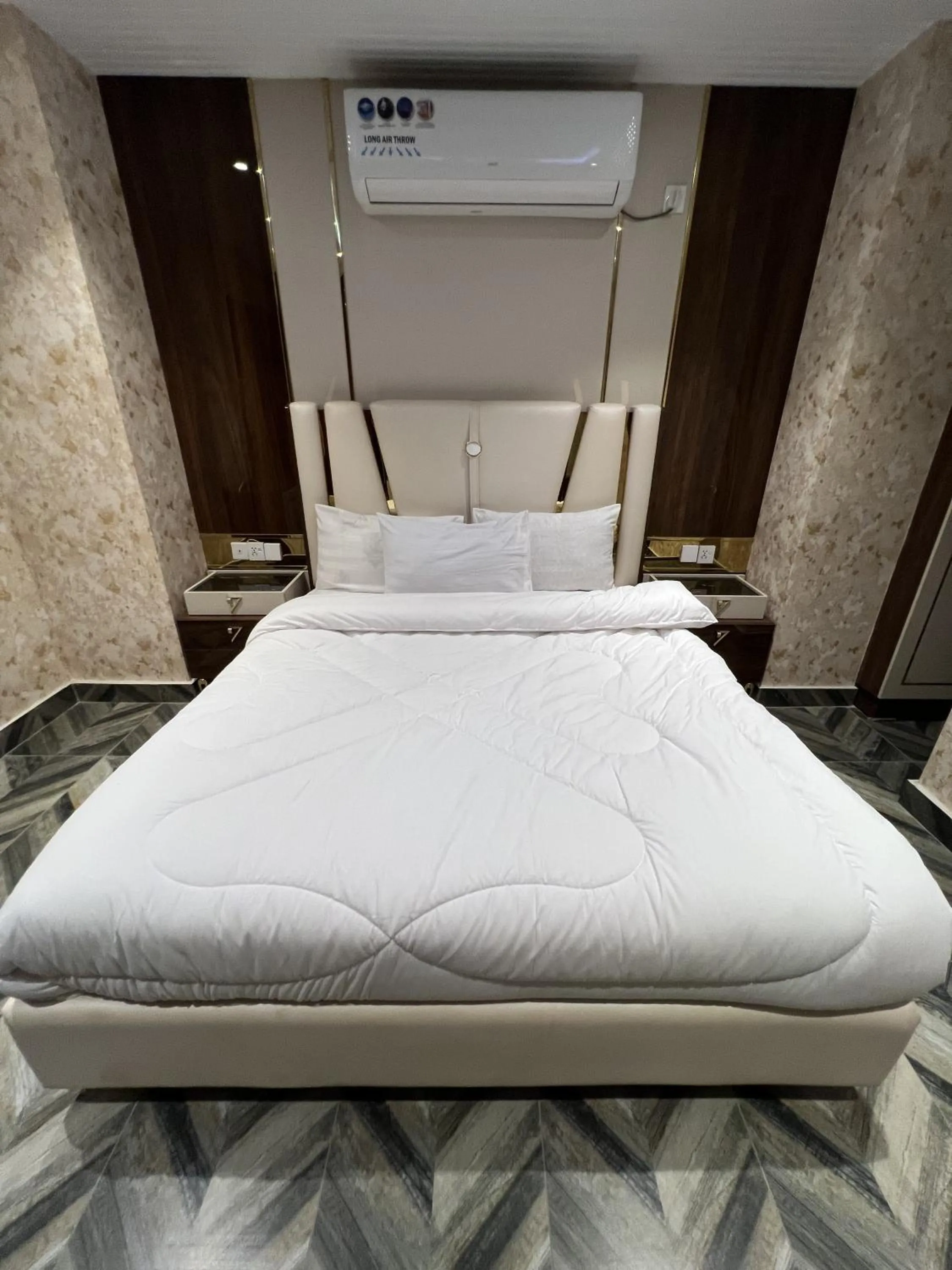 Bed in Courteous Hotel