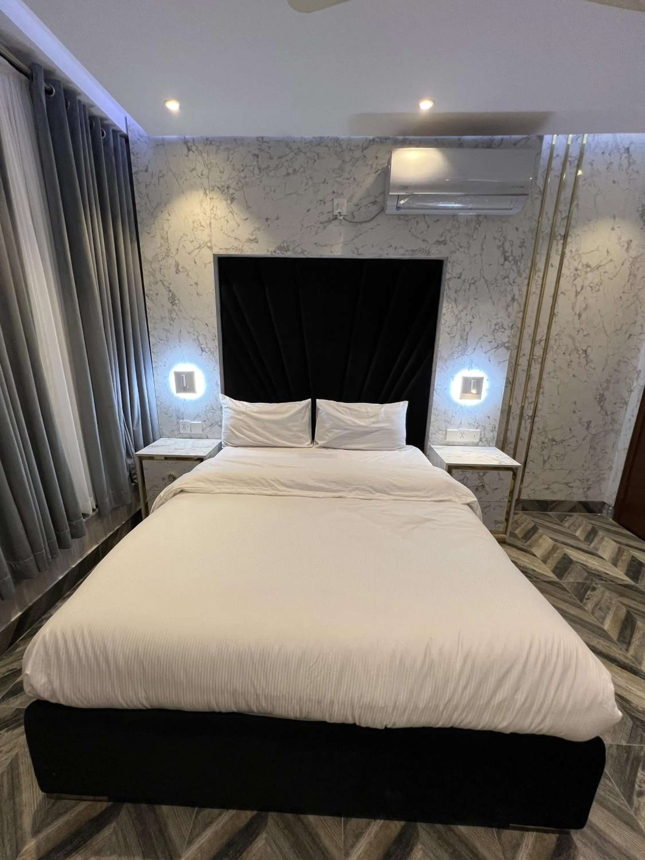 Bed in Courteous Hotel
