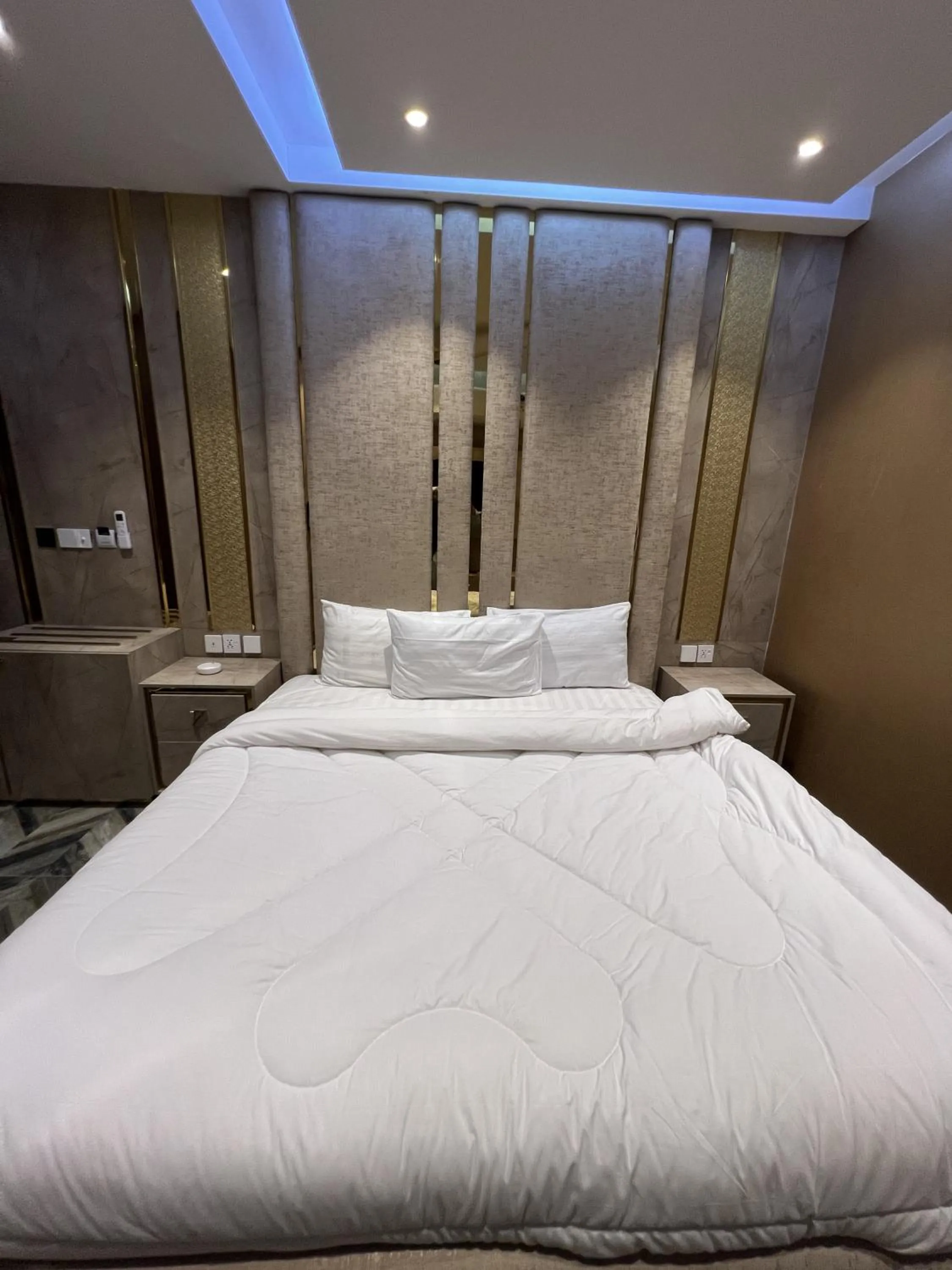 Bed in Courteous Hotel