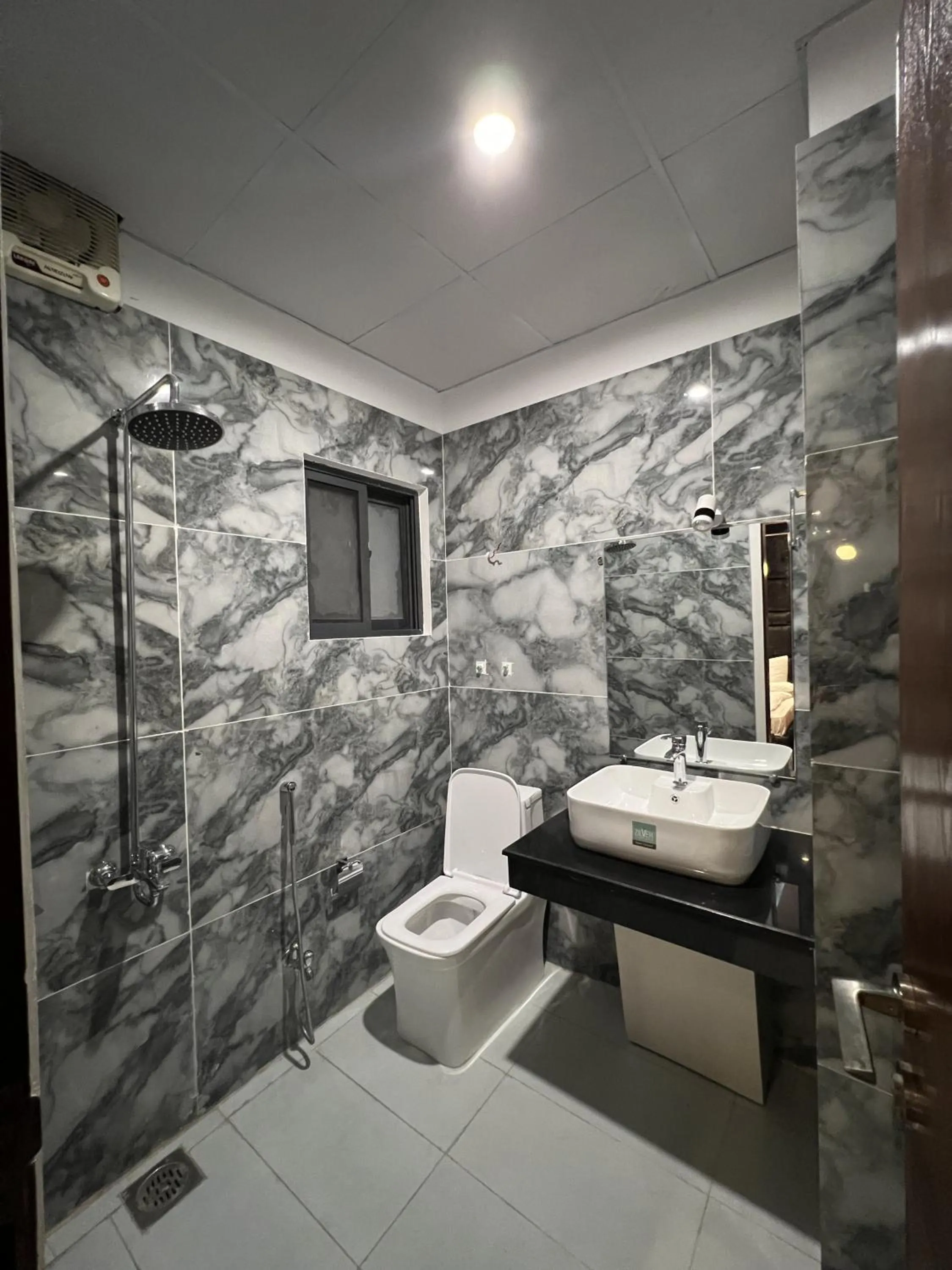 Toilet in Courteous Hotel