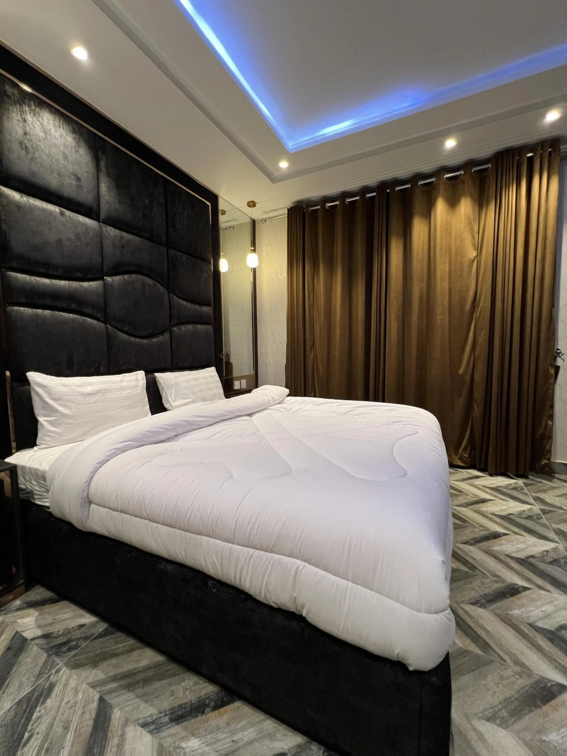Bed in Courteous Hotel