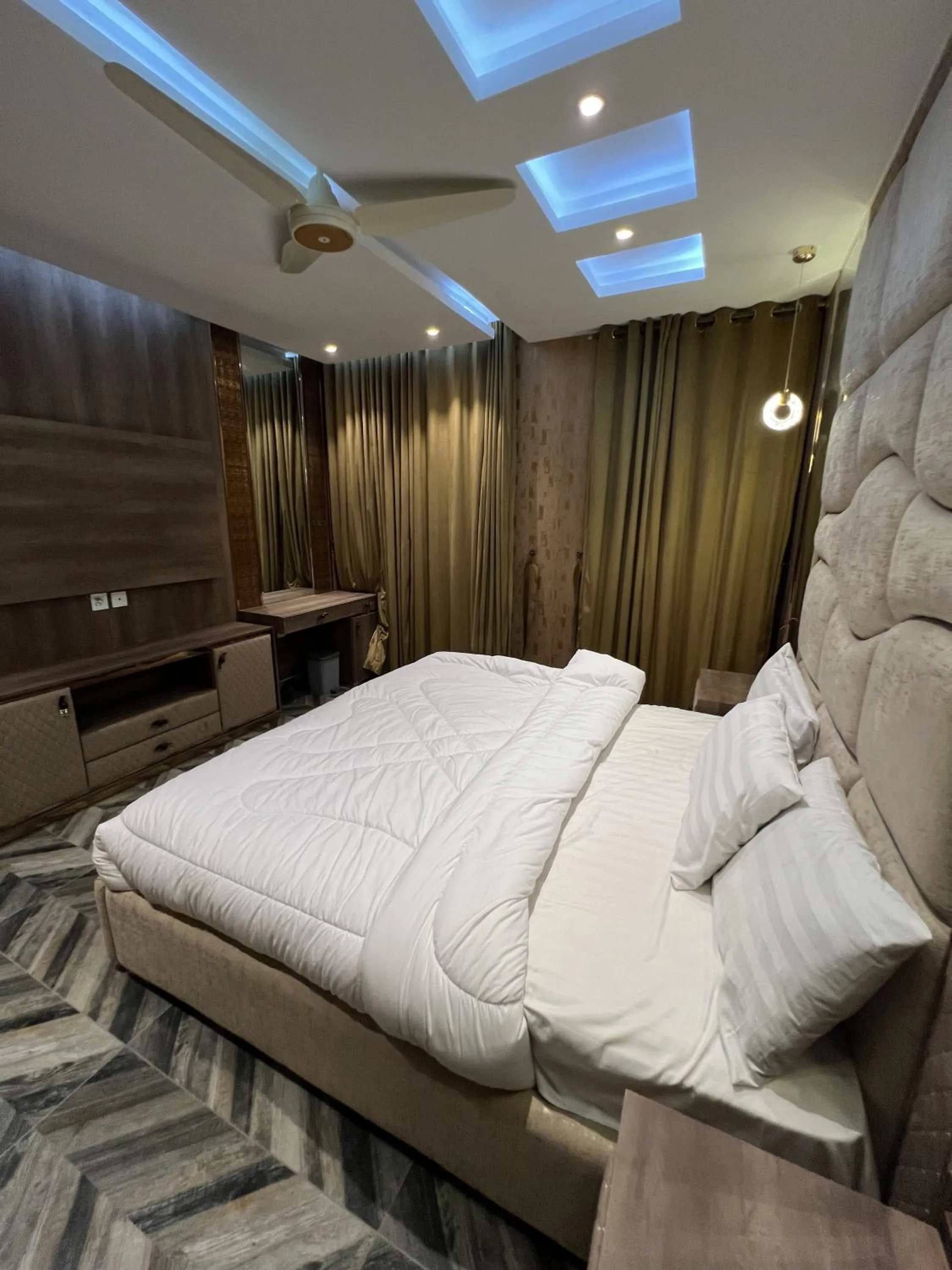 Bed in Courteous Hotel