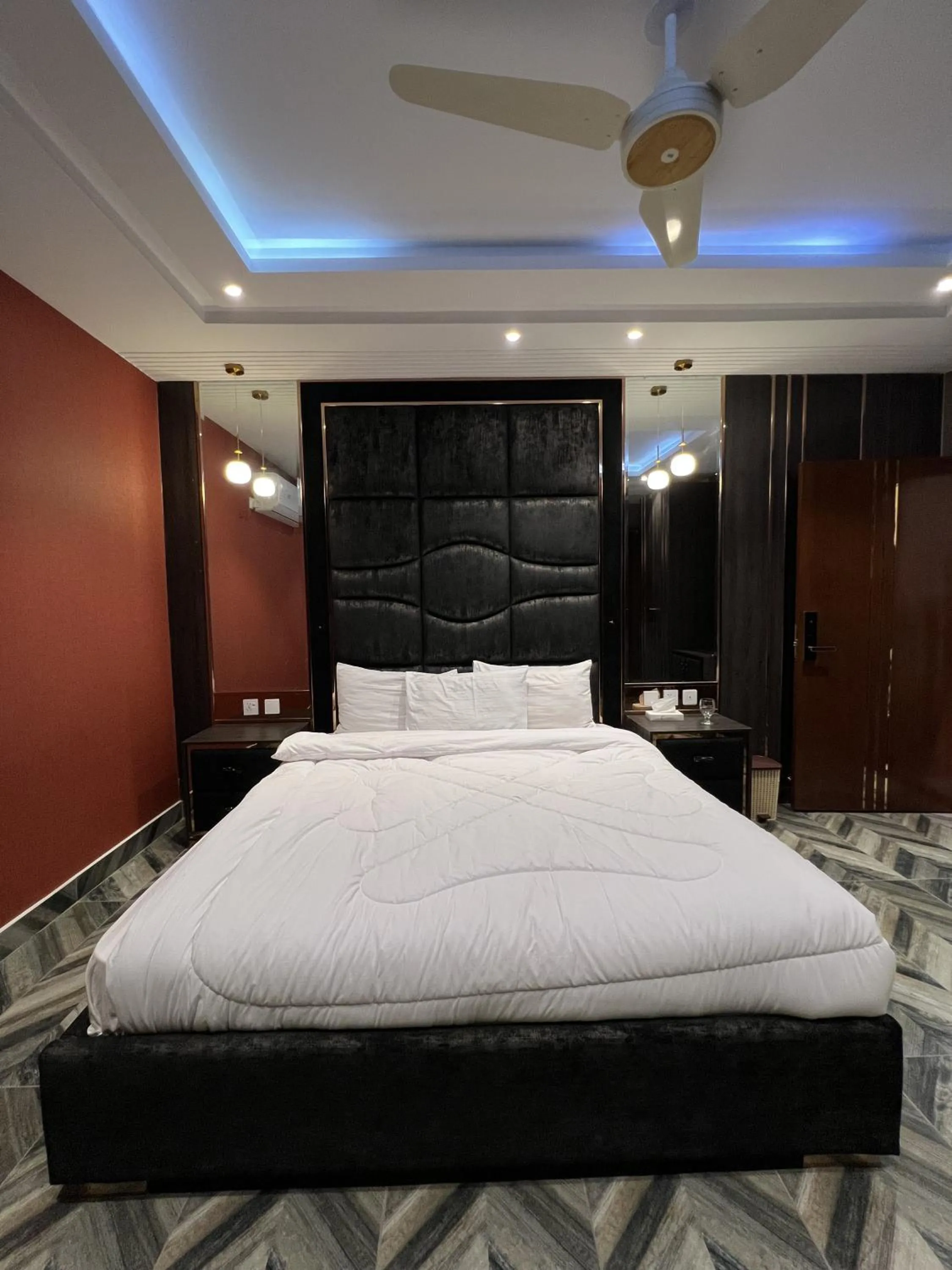 Bed in Courteous Hotel