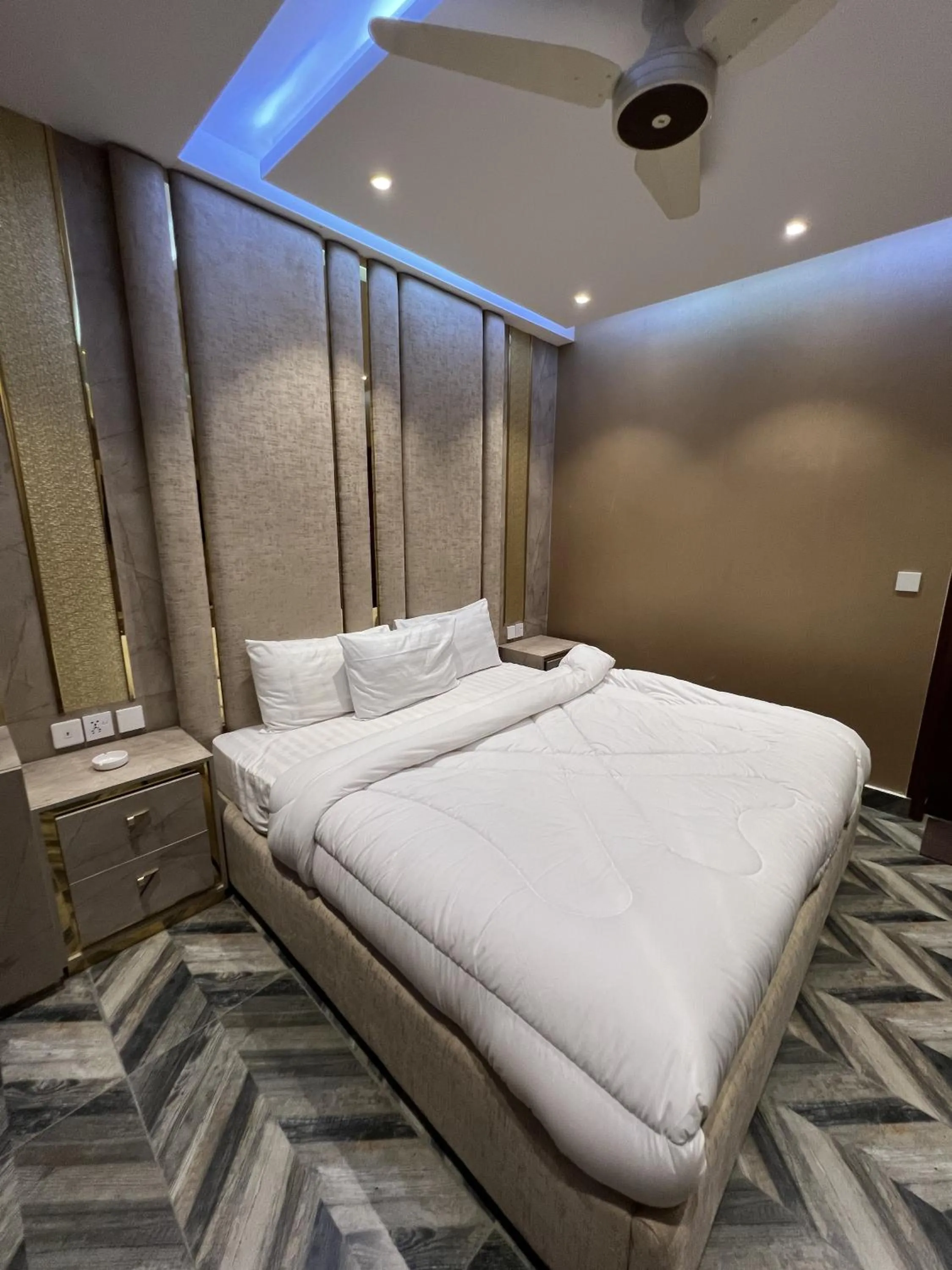 Bed in Courteous Hotel